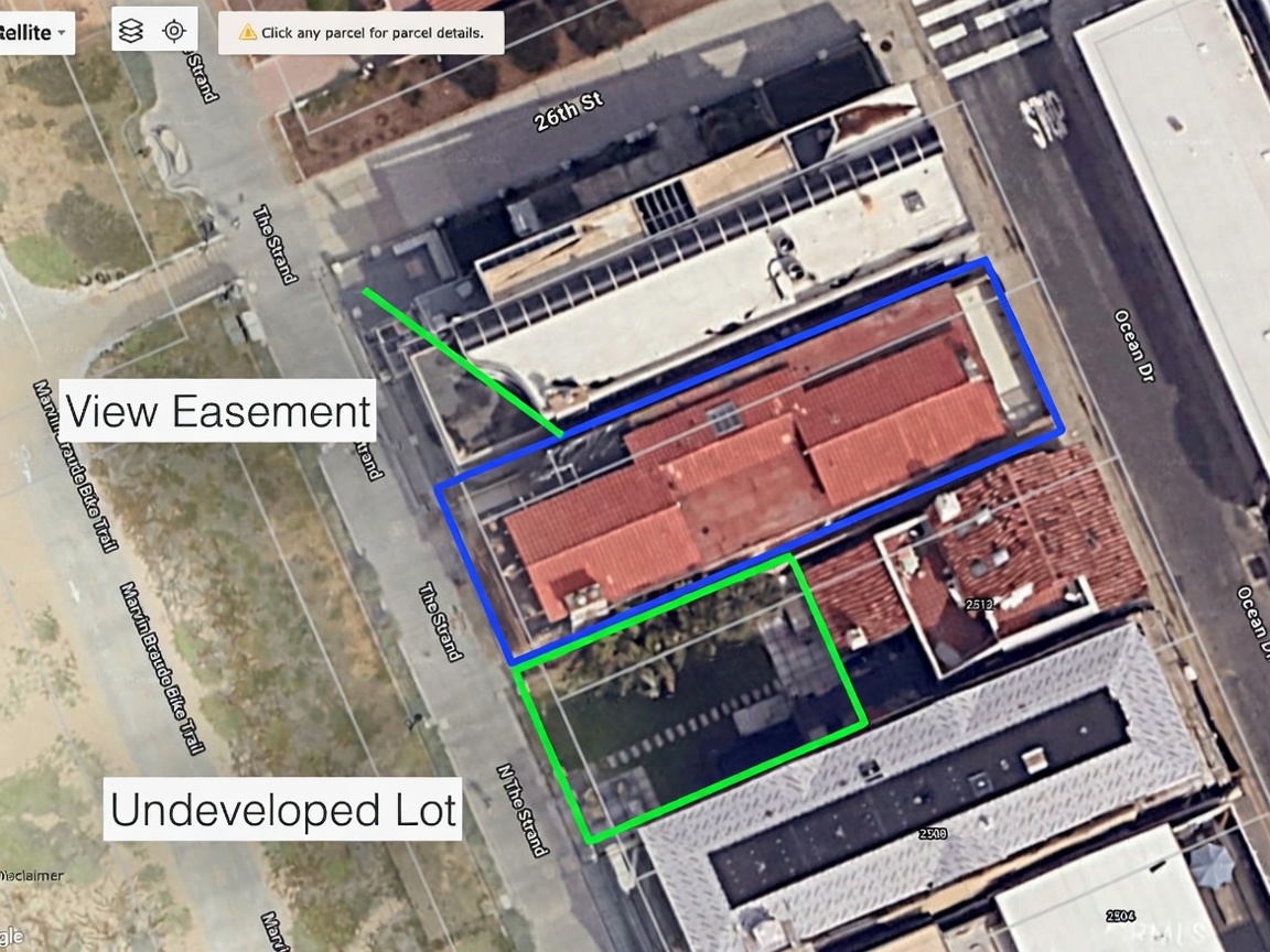 This aerial view captures a coastal property layout, highlighting a primary building outlined in blue and an adjacent undeveloped lot outlined in green. The perspective provides a clear overview of the property's proximity to the beach, the Marvin Braude Bike Trail, and local street access. The image includes annotations identifying a view easement and the undeveloped parcel, offering a strategic look at the land's potential and positioning.