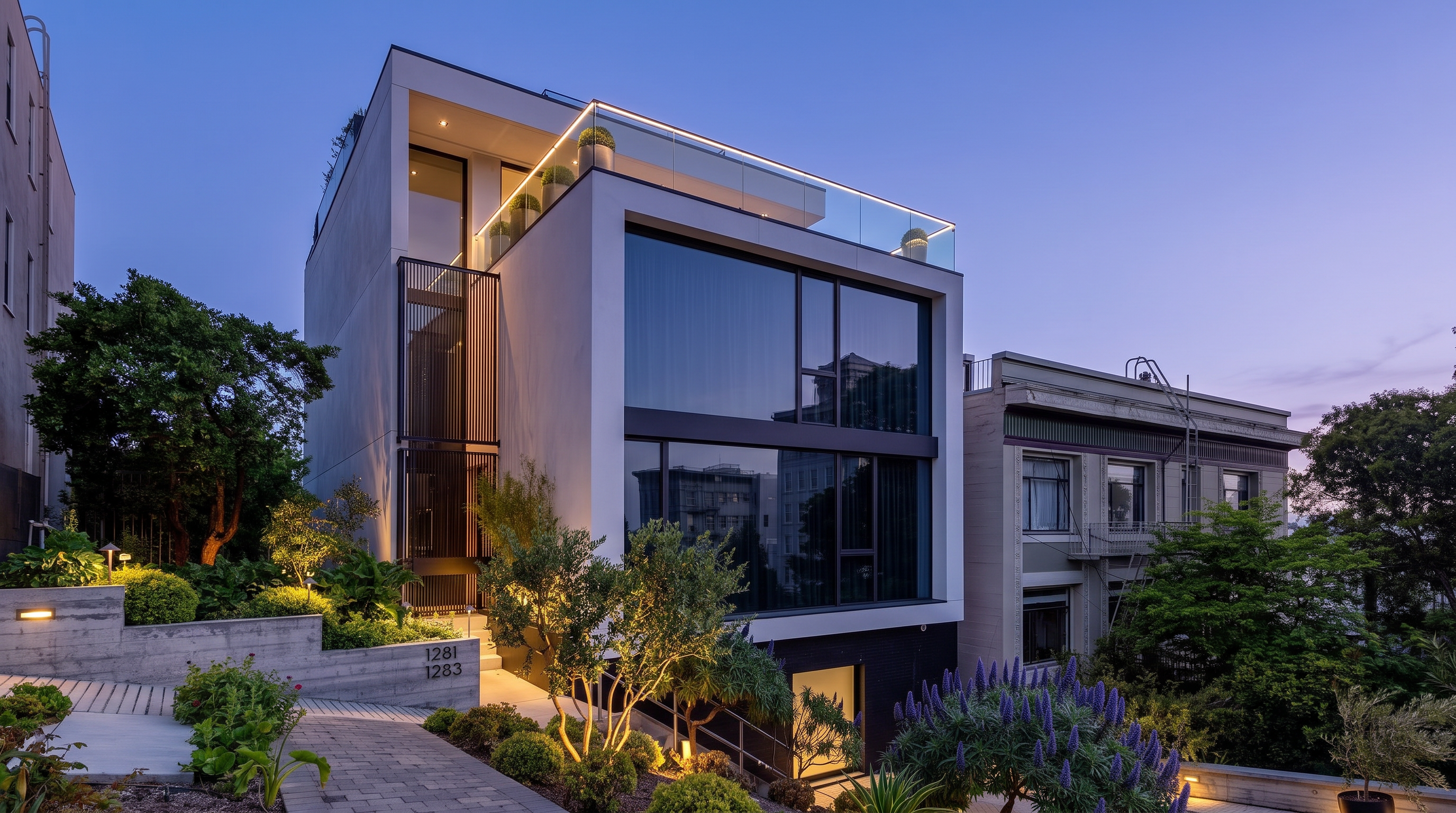 This modern, multi-level residence features a striking architectural design with a clean white facade and expansive floor-to-ceiling windows that reflect the surrounding neighborhood. The property includes a private rooftop terrace with glass railings and a landscaped front garden with a paved walkway leading to the entrance. The contrast between the contemporary structure and the adjacent historic building creates a unique urban aesthetic.