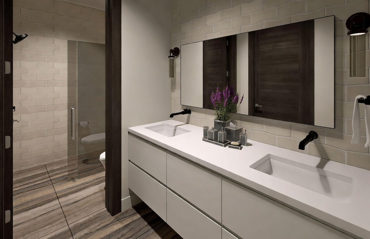 This modern primary bathroom features a sleek double-vanity with a white countertop and dark wood cabinetry. A large, wide mirror reflects the space, which is accented by matte black fixtures and a light-colored subway tile wall. To the left, a glass-enclosed shower area is visible, complemented by wood-look tile flooring that adds warmth to the contemporary design.