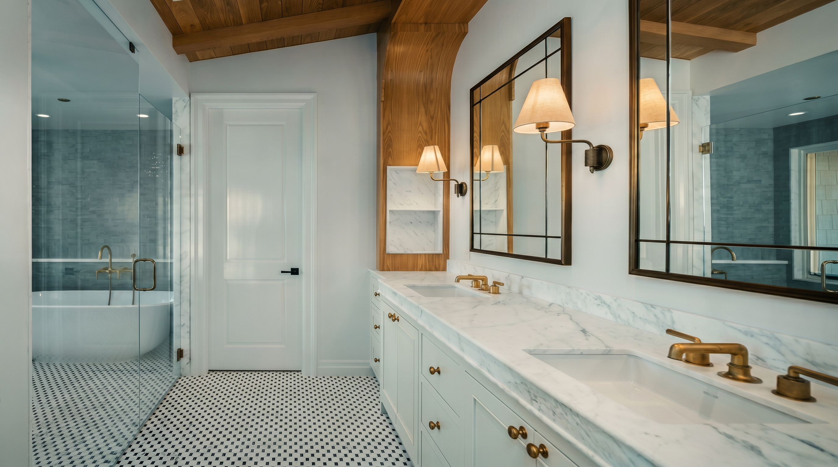 This elegant primary bathroom features a double vanity with stone countertops, gold-toned fixtures, and framed mirrors. To the left, a glass-enclosed shower area includes a freestanding tub, while the floor is finished in a classic black-and-white patterned tile. The space is accented by light wood trim and beams on the ceiling, creating a sophisticated and bright atmosphere.