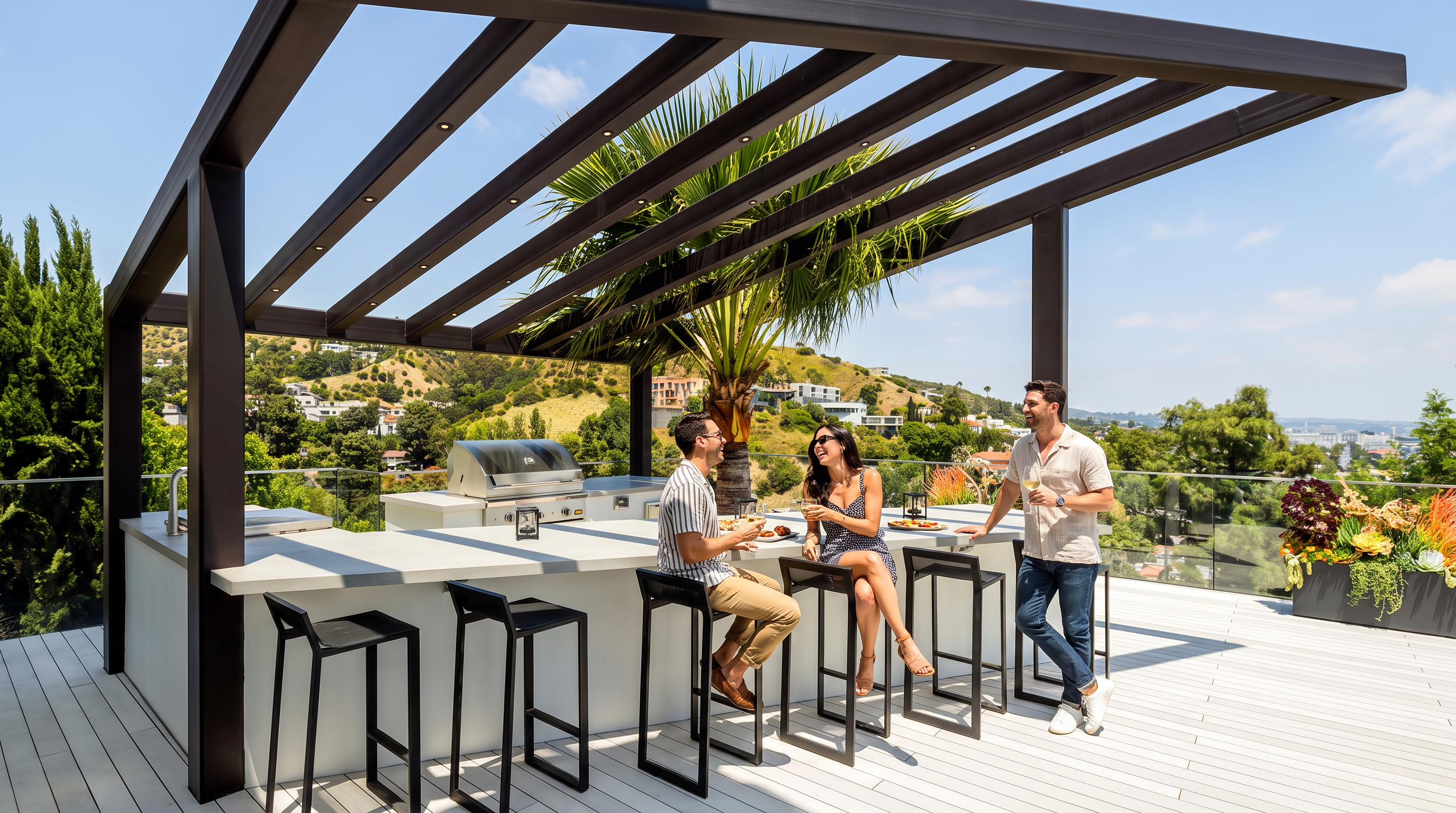 This modern, elevated outdoor patio features a sleek, built-in kitchen island with premium stainless steel appliances and bar seating, sheltered by a stylish dark-framed pergola. The space overlooks a scenic hillside with lush greenery, providing an ideal setting for entertaining with its contemporary design, light-toned decking, and open-air atmosphere.