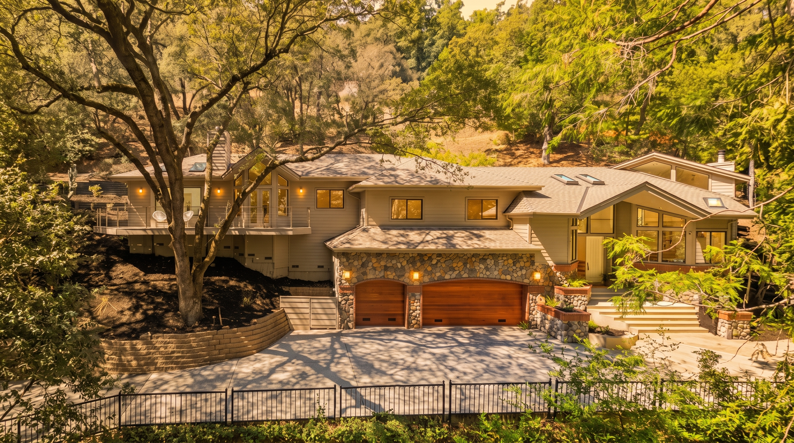 This is a beautiful, multi-level home nestled in a wooded setting, featuring a mix of siding and natural stone accents. The exterior highlights include a spacious three-car garage, a large upper-level deck, and a sweeping paved driveway. The home's architectural design blends seamlessly with the surrounding landscape, offering a welcoming and sophisticated curb appeal.