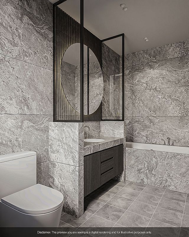 This is a modern primary bathroom featuring gray marble walls and flooring, creating a luxurious and cohesive aesthetic. A unique vanity with a dark wood cabinet and a round mirror is the focal point, complemented by a sleek toilet and a built-in bathtub. The design emphasizes clean lines and high-end materials, offering a spa-like atmosphere.