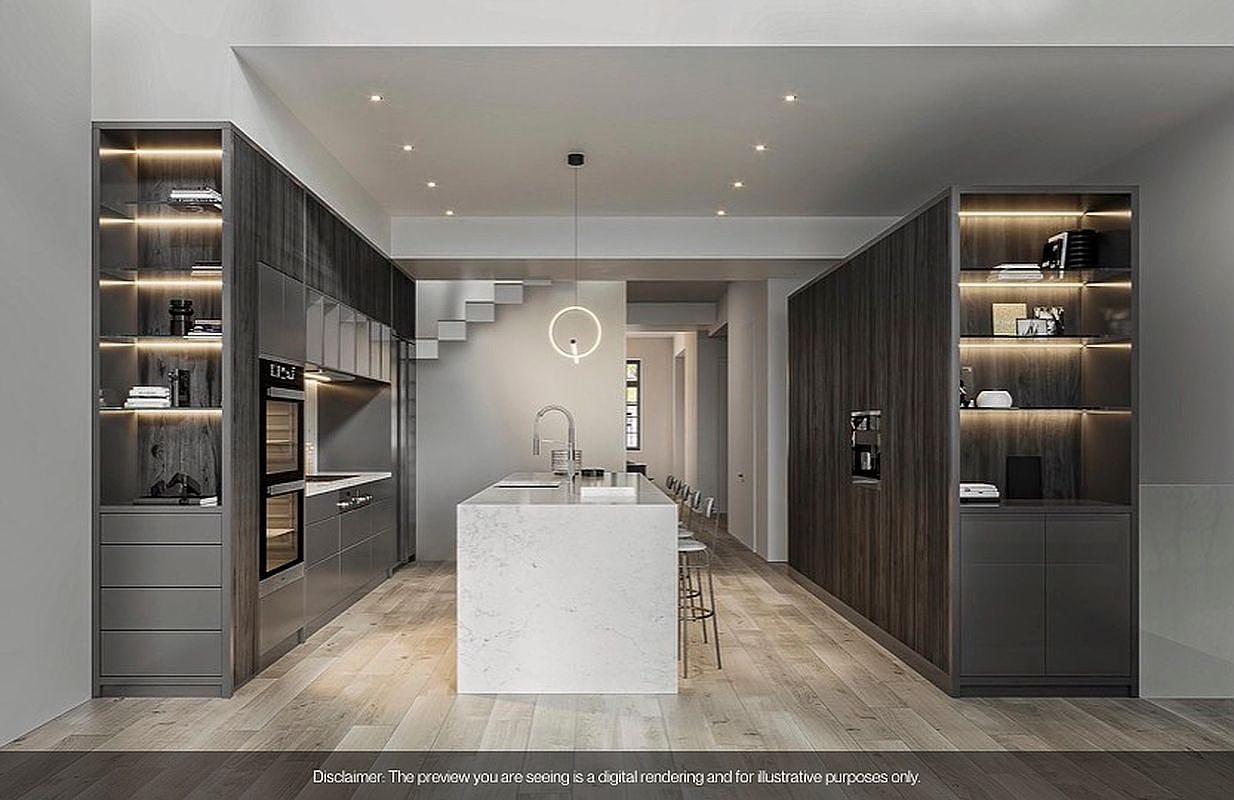 This is a modern kitchen with sleek, gray cabinetry and a large white island. The kitchen features built-in appliances and open shelving with integrated lighting. The space is well-lit with recessed lighting and a modern pendant light, creating a clean and sophisticated atmosphere.