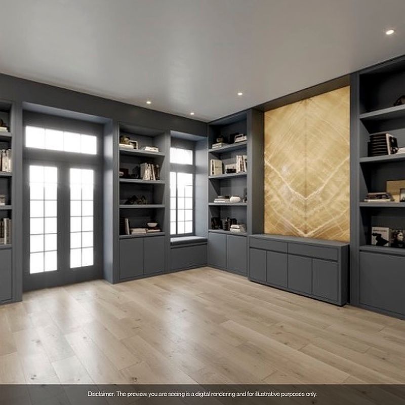 This interior shot showcases a sophisticated home office or study, featuring custom built-in shelving and cabinetry in a dark gray hue. A large window provides ample natural light, complementing the light wood flooring. The room exudes a sense of organization and refined taste, perfect for a professional or avid reader.