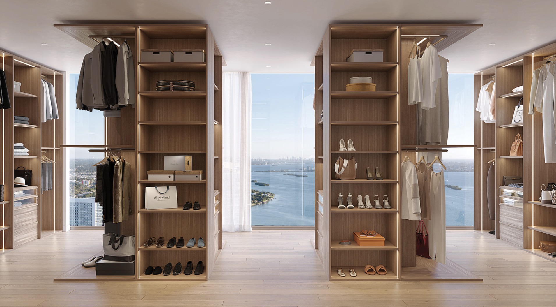 This is a luxurious walk-in closet featuring custom wood shelving and ample storage space for clothing, shoes, and accessories. The closet is well-lit with integrated lighting, highlighting the organized layout and high-end finishes. A large window provides natural light and a scenic view, enhancing the overall appeal of the space.