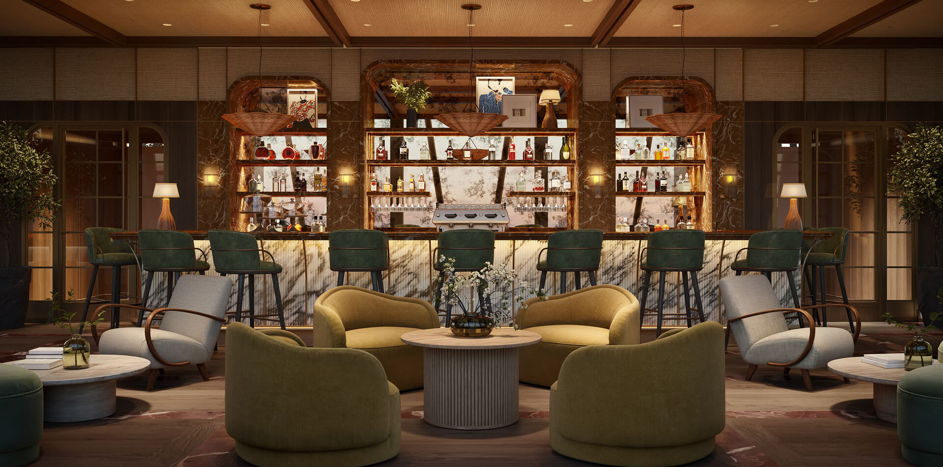 This interior shot showcases a stylish lounge area, likely within a hotel or upscale residence, featuring comfortable armchairs arranged around a central coffee table. A well-stocked bar with marble countertops and green bar stools is visible in the background, creating an inviting atmosphere for relaxation and socializing. The warm lighting and sophisticated decor contribute to a luxurious and welcoming ambiance.