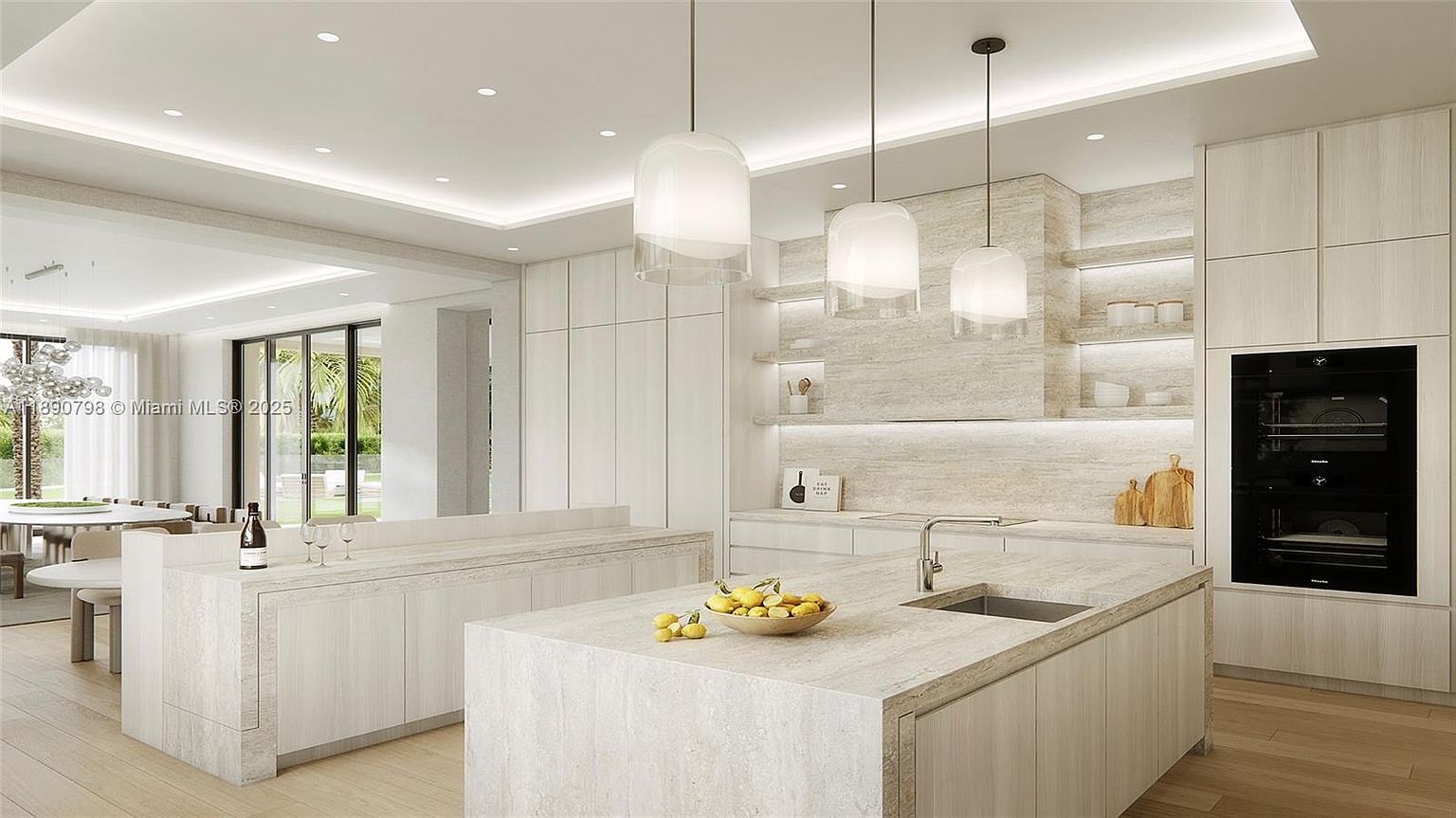 This is a bright and modern kitchen featuring light wood cabinetry and countertops with a subtle stone pattern. The kitchen includes a central island with a sink, pendant lighting, and built-in appliances, including a double oven. The space is open and airy, with a view into an adjacent dining area, creating a seamless flow for entertaining.