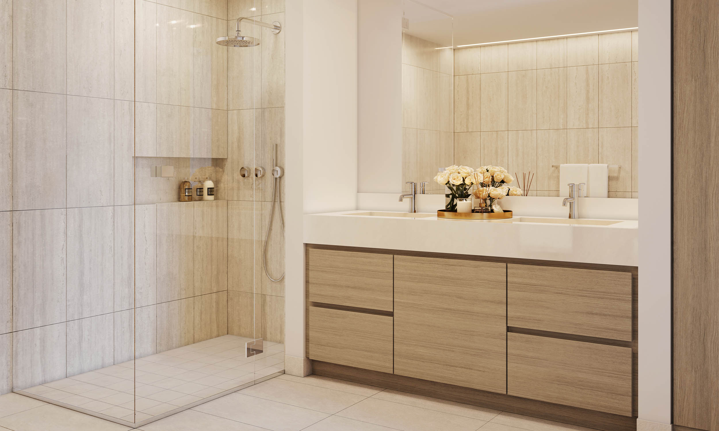 This is a modern primary bathroom featuring a walk-in shower with a rainfall showerhead and a built-in niche for toiletries. The double vanity has a white countertop and light wood cabinetry, complemented by a large mirror. The overall aesthetic is clean, bright, and luxurious, creating a spa-like atmosphere.