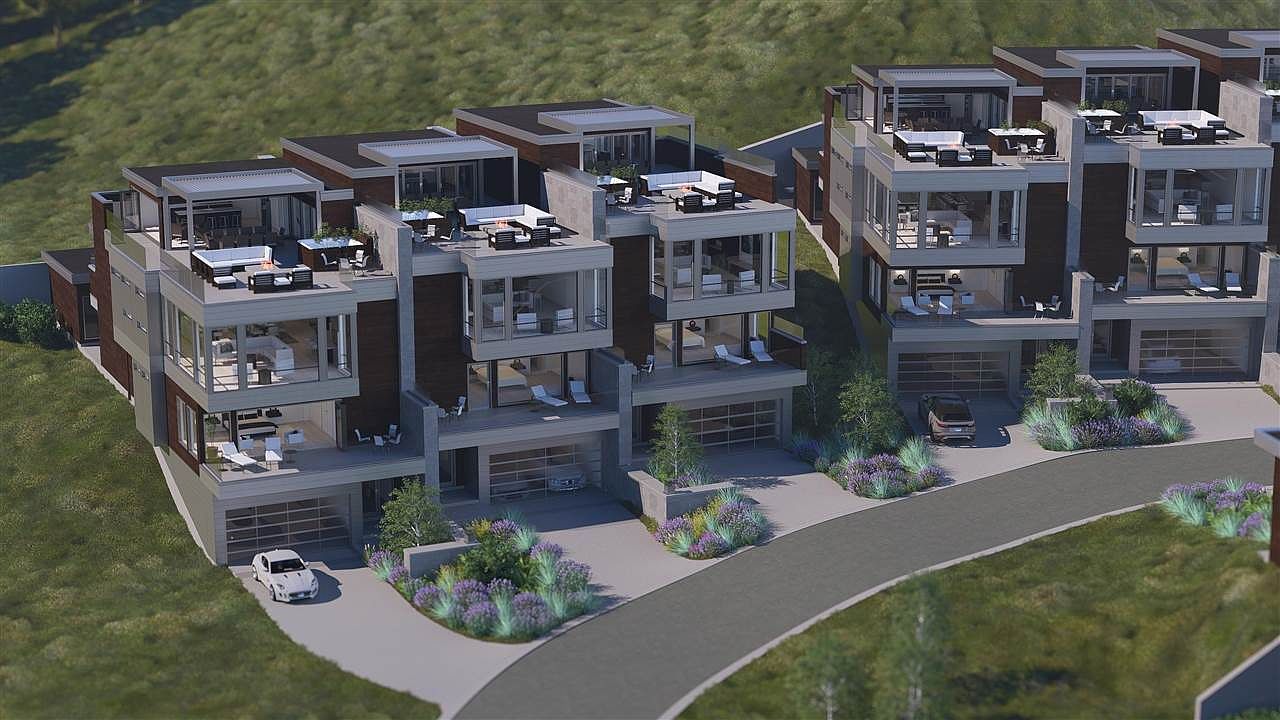 This image showcases the front view of modern townhouses, featuring a contemporary architectural style with clean lines, large windows, and rooftop terraces. Each unit has a private garage and well-manicured landscaping, enhancing the curb appeal and creating a luxurious living environment. The perspective is from a slightly elevated position, providing a comprehensive view of the property's facade and surrounding landscape.