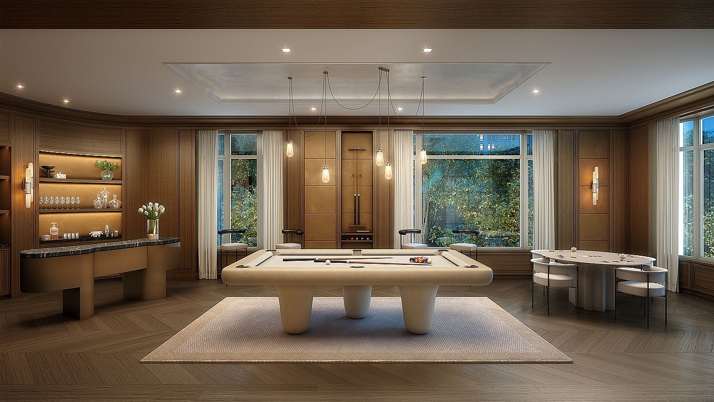 This sophisticated game room features a central billiards table with a unique, rounded base, set atop a textured area rug. The space is defined by rich wood-paneled walls, a built-in bar area with illuminated shelving, and a separate circular card table. Large windows with sheer curtains allow natural light to filter in, creating an elegant and inviting atmosphere for entertainment.