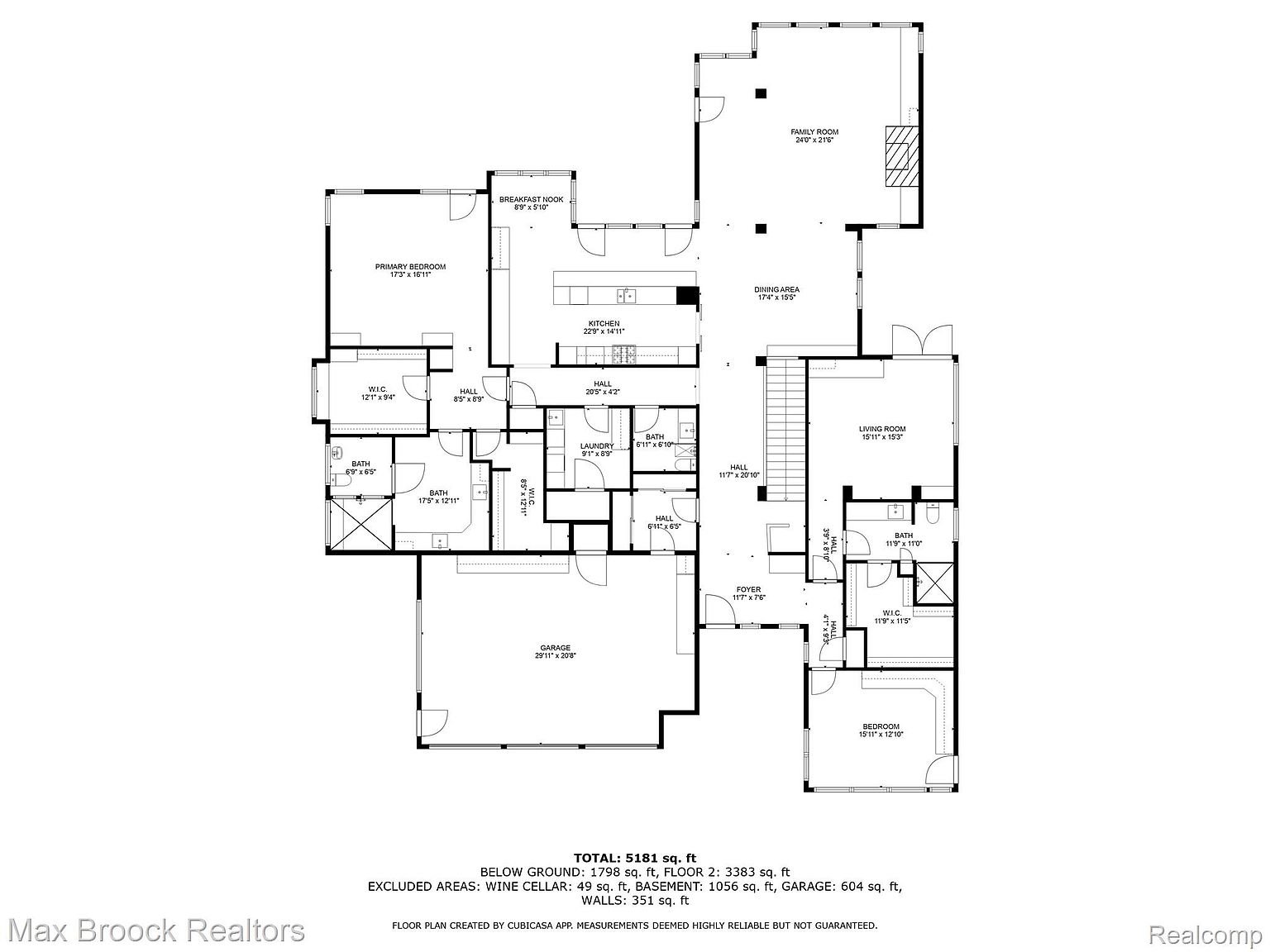 This is a detailed floor plan of a two-story house, showcasing the layout of rooms on both floors. The plan includes dimensions for each room, such as the primary bedroom, kitchen, living room, and garage, providing a comprehensive overview of the property's spatial arrangement. The total square footage is noted, along with excluded areas like the wine cellar and garage.