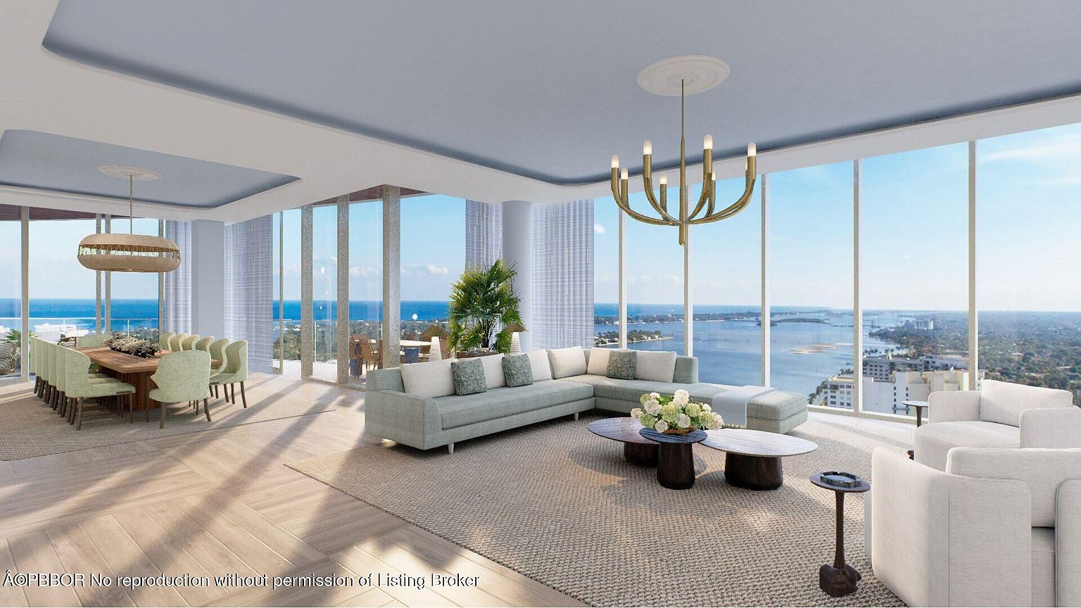 This is a luxurious living room and dining area with floor-to-ceiling windows offering panoramic ocean views. The space features a large sectional sofa, modern lighting fixtures, and a dining table with seating for many. The overall design is elegant and contemporary, creating a bright and airy atmosphere.