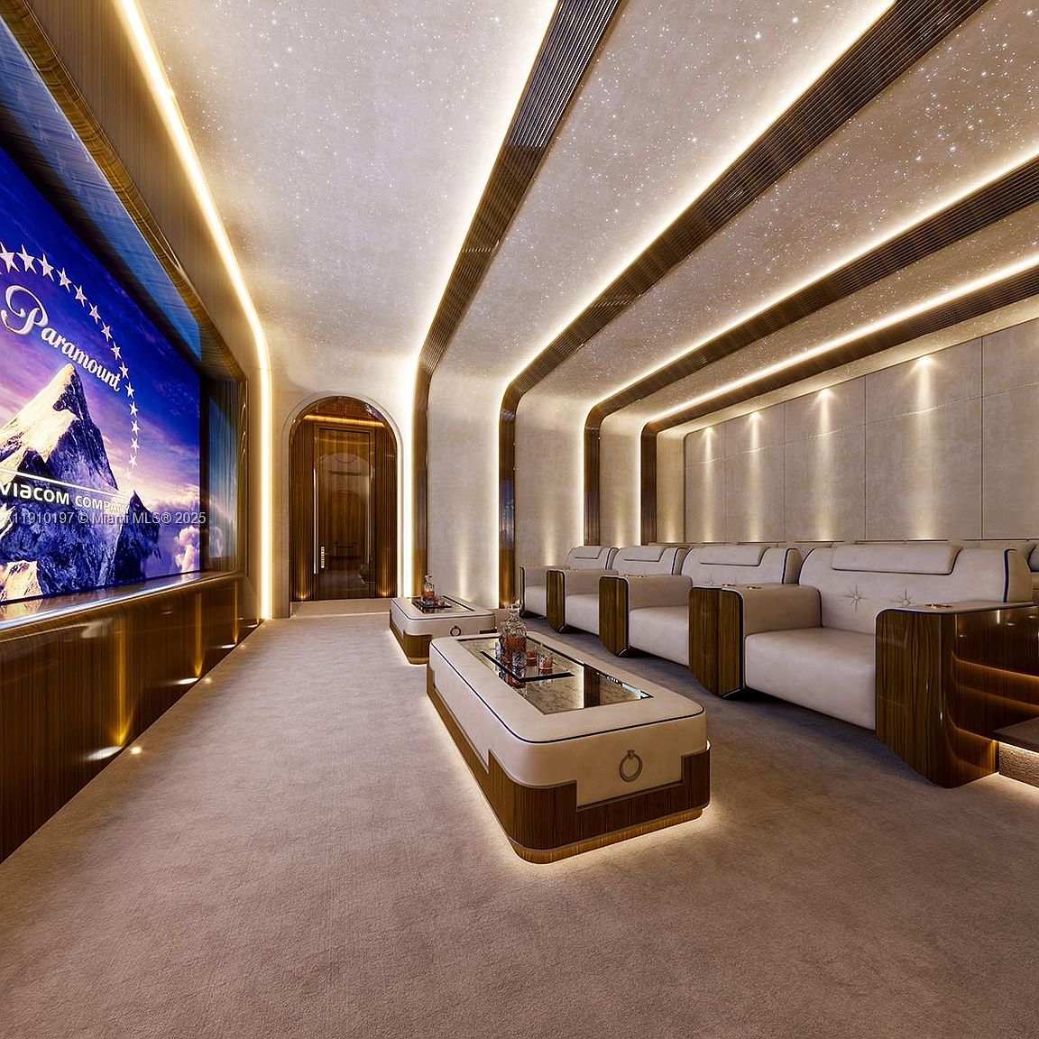 This is a luxurious home theater featuring a large screen displaying the Paramount logo, comfortable seating, and ambient lighting. The room has a modern design with wood paneling and a star-like ceiling, creating a cinematic experience. The layout includes a central aisle and coffee tables, enhancing the viewing experience.