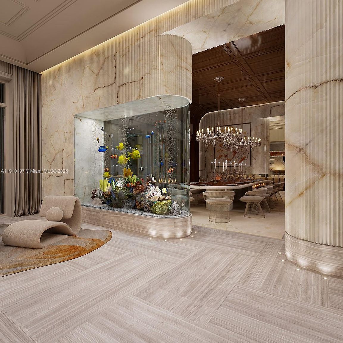 This interior shot showcases a luxurious living area featuring a large, built-in aquarium filled with colorful fish and coral. The room is decorated with elegant marble walls, a modern lounge chair, and herringbone-patterned wood flooring. A glimpse into the dining area reveals a grand chandelier and a formal dining set, suggesting a sophisticated and upscale ambiance.
