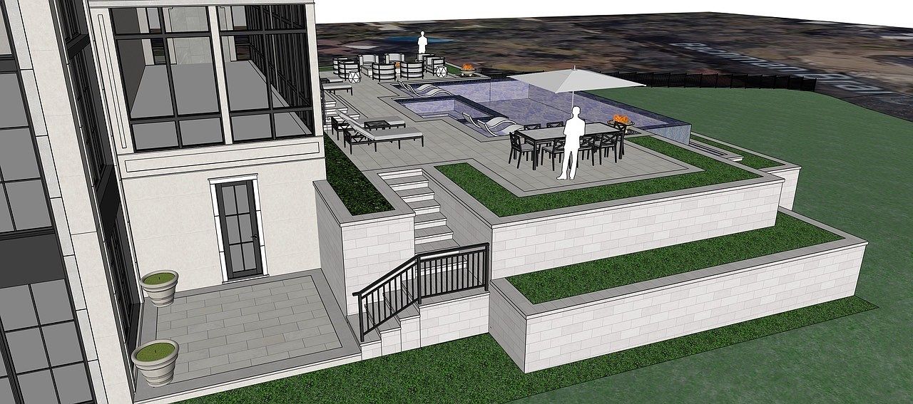 This image showcases a multi-tiered outdoor living space, featuring a patio with dining furniture and an umbrella, a pool area with lounge chairs, and a balcony accessible from the building. The design incorporates green spaces and retaining walls, creating a luxurious and inviting atmosphere. The perspective is a wide shot, capturing the full scope of the outdoor design.