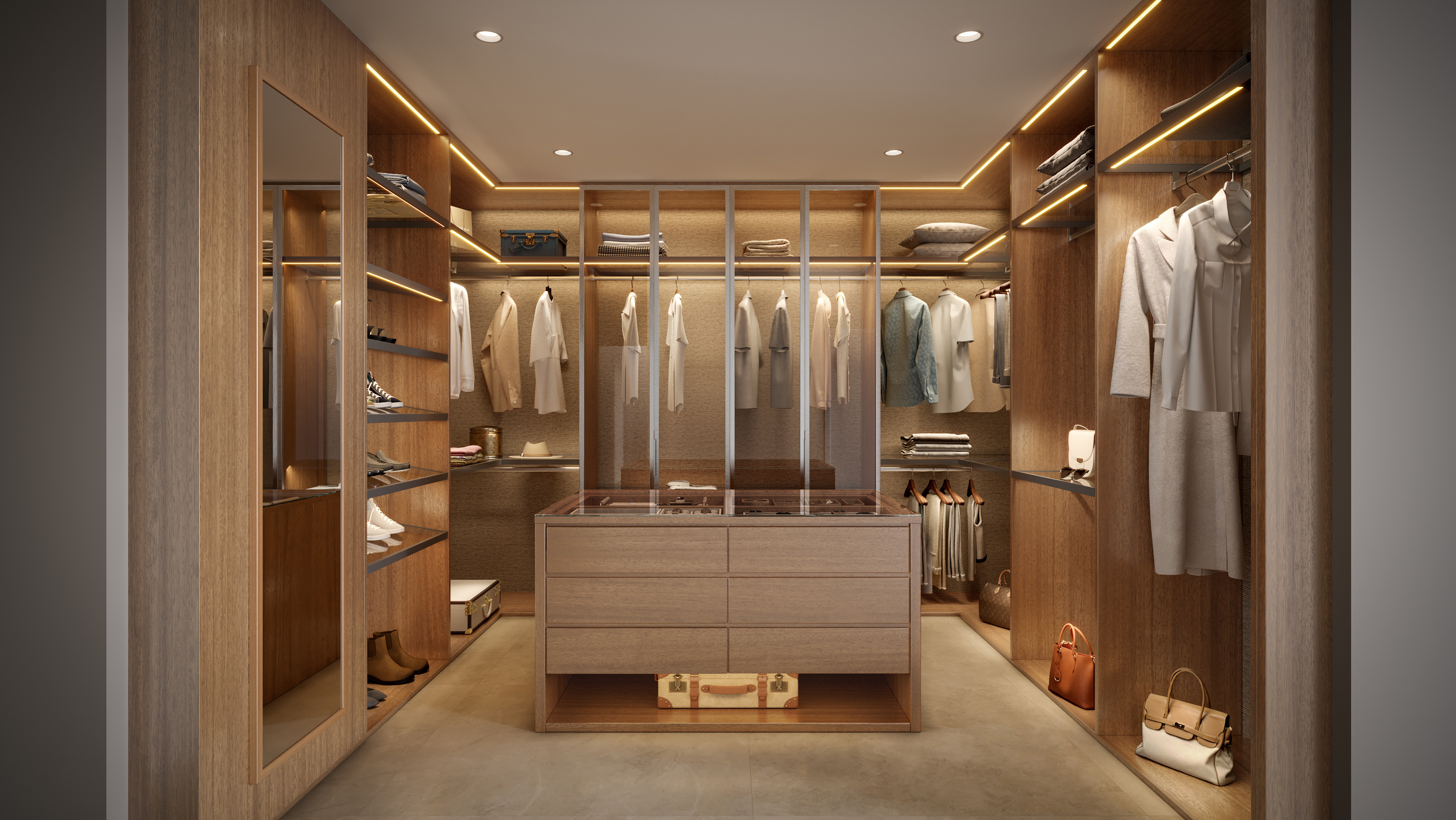 This is a well-organized walk-in closet with wooden cabinetry and shelving. The closet features hanging rods for clothes, shelves for shoes and accessories, and a central island with drawers and a glass top. The warm lighting and neutral color palette create a luxurious and inviting space.