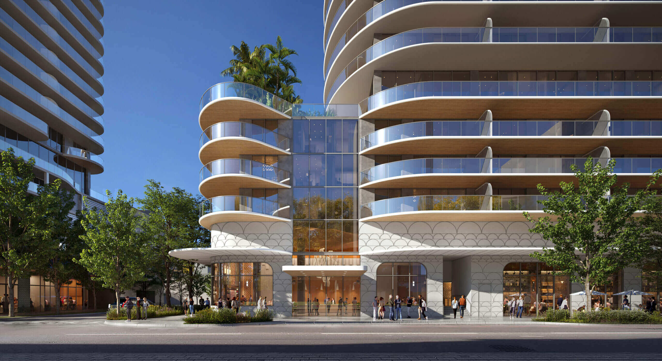 This image showcases the front exterior of a modern residential building, featuring curved balconies with glass railings and a unique architectural design. The building's facade incorporates a blend of glass and textured concrete, creating a sophisticated and contemporary aesthetic. Lush greenery surrounds the base of the building, enhancing its curb appeal and creating a welcoming atmosphere.
