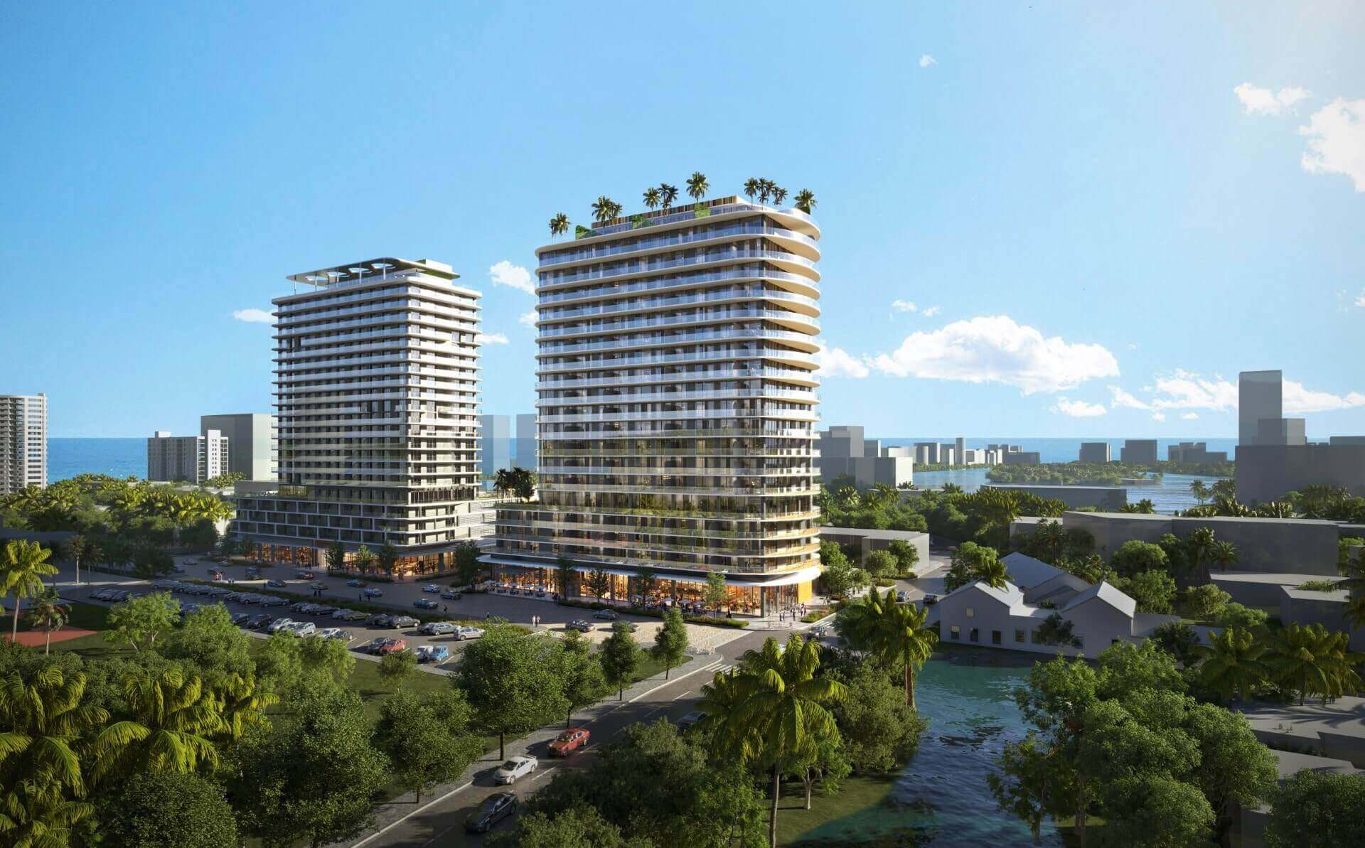This aerial view showcases two modern high-rise residential buildings with sleek architectural designs, surrounded by lush greenery and waterways. The buildings feature multiple balconies and rooftop amenities, suggesting luxury living with scenic views. The image captures a vibrant urban landscape with a blend of nature and contemporary architecture.