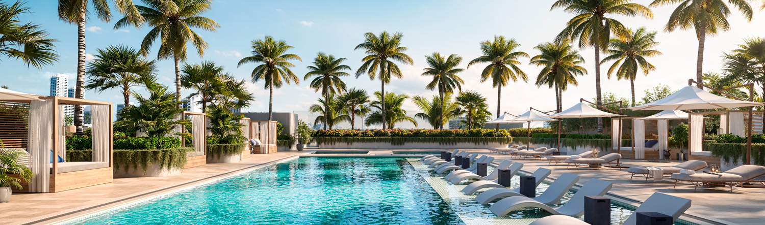 This image showcases a luxurious outdoor pool area surrounded by lush palm trees and modern amenities. The pool features built-in lounge chairs, and the deck is furnished with comfortable sunbeds and private cabanas. The scene evokes a sense of relaxation and upscale resort living, perfect for attracting potential buyers seeking a high-end lifestyle.