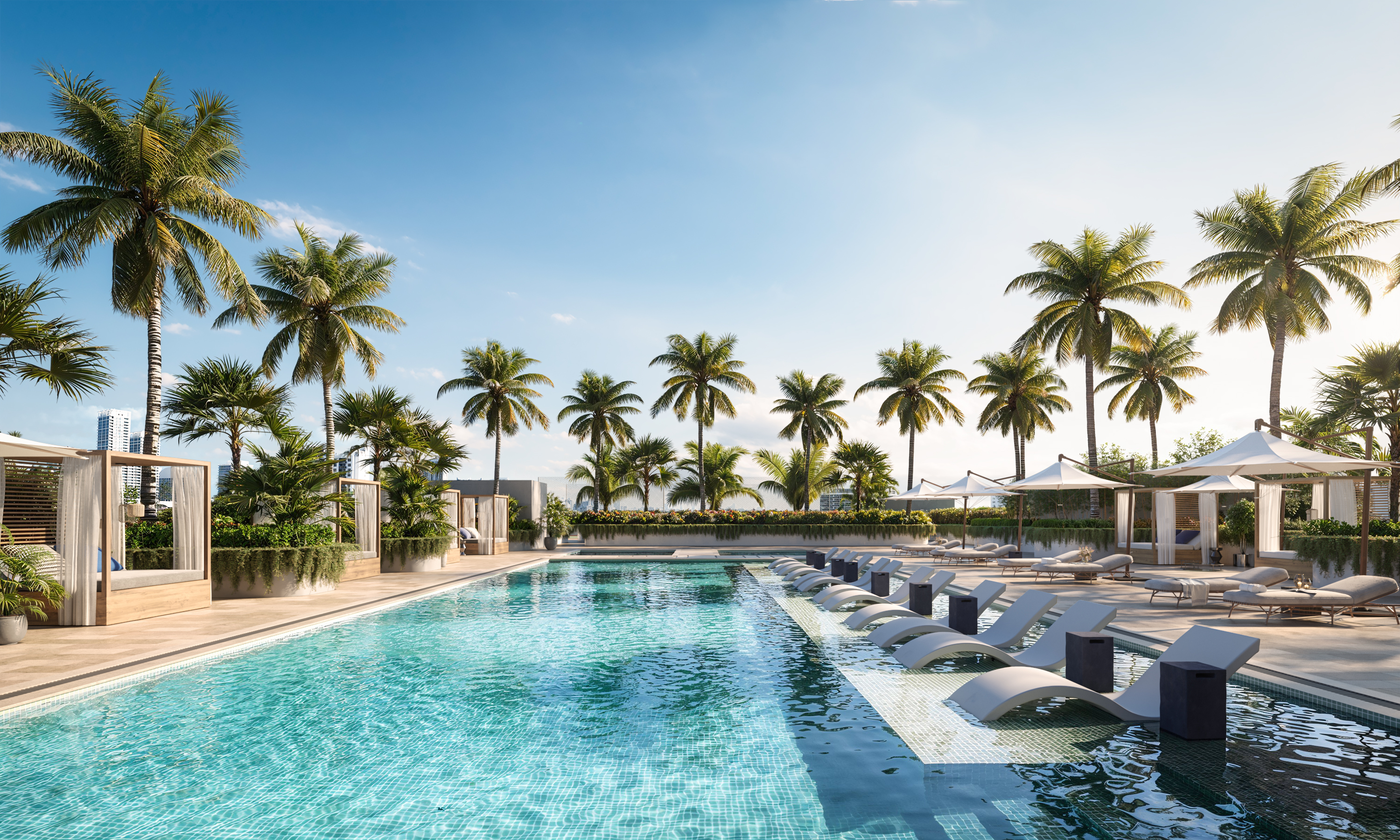 This image showcases a luxurious outdoor pool area, complete with in-water lounge chairs and surrounding palm trees. The pool's clear, turquoise water invites relaxation, while cabanas and lounge areas offer shaded retreats. The overall impression is one of high-end resort living.