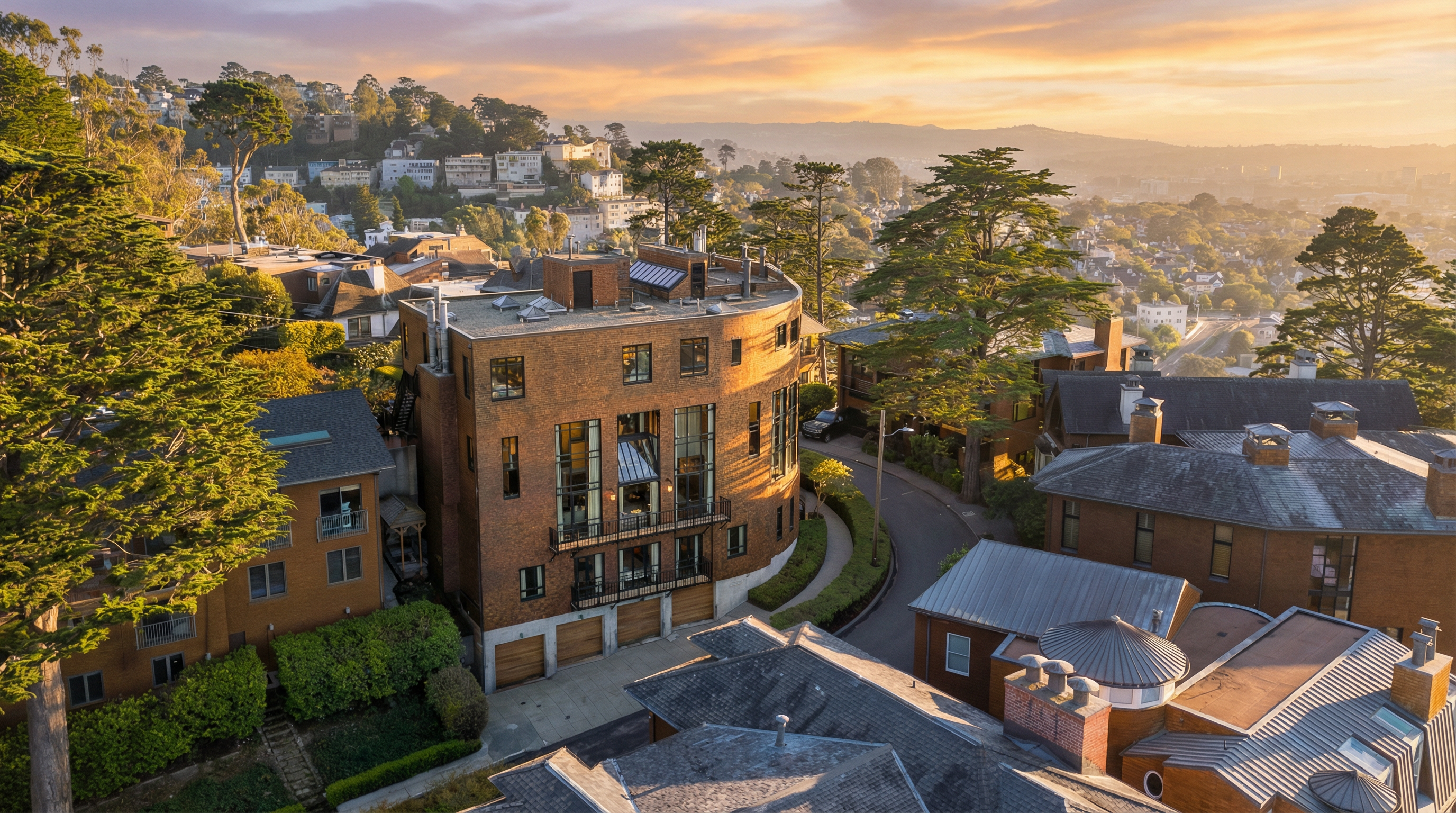 This aerial view showcases a luxurious residential area with a unique, curved brick building as a focal point. The surrounding landscape features lush greenery, mature trees, and other well-maintained homes, creating an impression of exclusivity and upscale living. The overall perspective provides a comprehensive view of the property's setting within a desirable neighborhood.