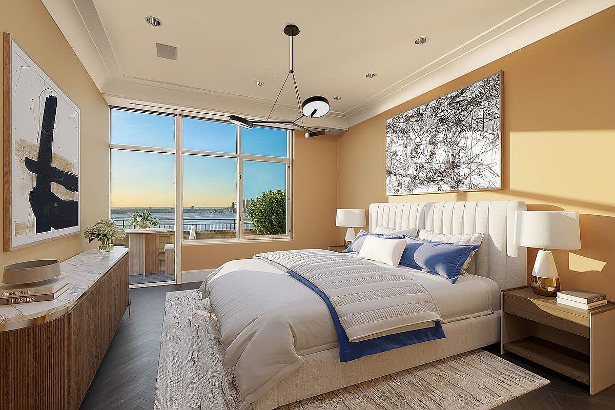 This elegant primary bedroom features a sophisticated neutral color palette with warm beige walls and a plush, upholstered headboard. A large floor-to-ceiling window provides a stunning, unobstructed view of the waterfront and city skyline, while a modern chandelier adds a contemporary touch. The room is furnished with a sleek marble-topped dresser and matching nightstands, creating a serene and luxurious atmosphere.