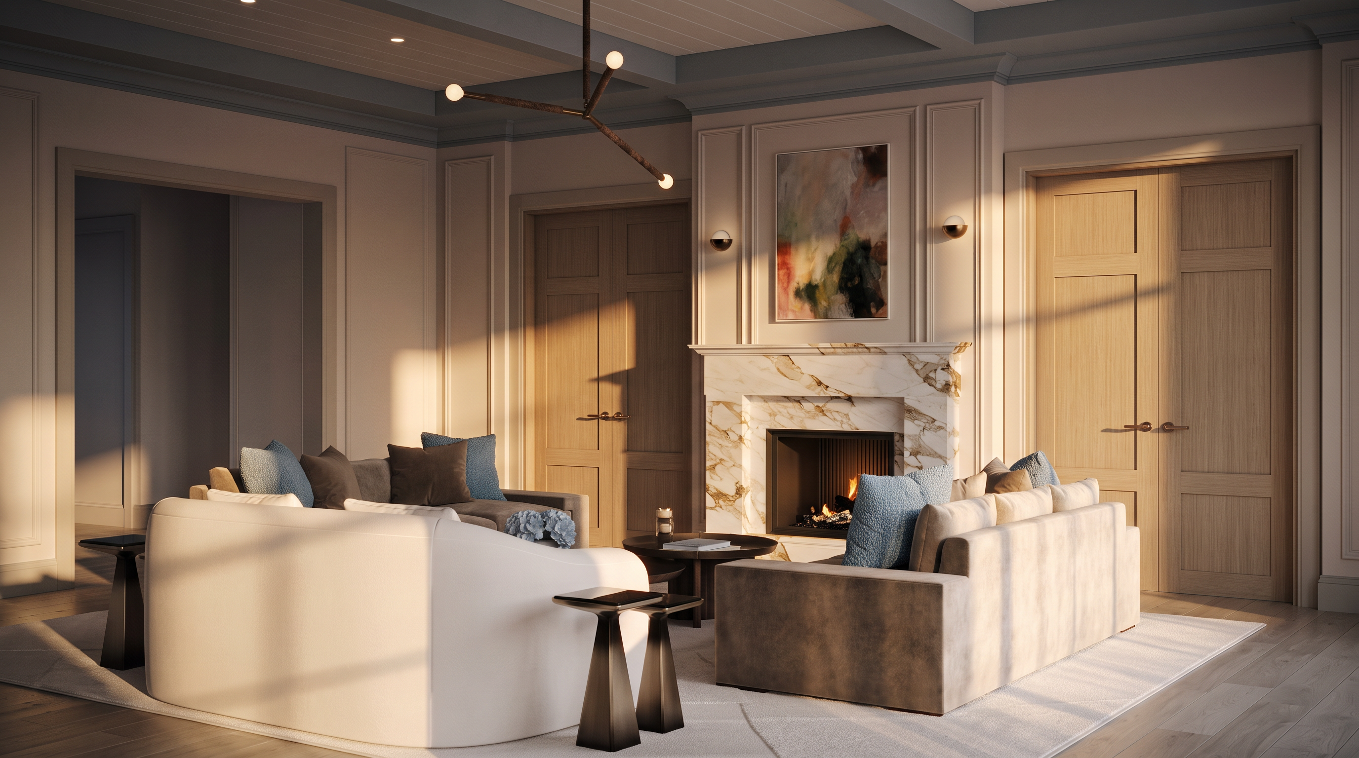 This elegant living room features a sophisticated neutral color palette with plush, light-toned seating arranged around a central stone-clad fireplace. The space is accented by a modern, multi-armed chandelier, warm wood-toned doors, and soft blue decorative pillows that add a subtle pop of color. The perspective captures a cozy, inviting atmosphere, highlighting the refined architectural molding and the warm glow of the fire.