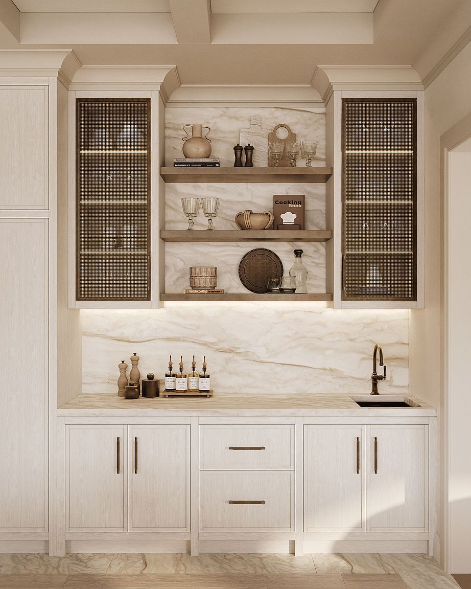 This elegant kitchen wet bar features light wood cabinetry with integrated mesh-front upper cabinets and a stone backsplash. Three open shelves provide display space for glassware and decor, while a small undermount sink with a dark faucet is set into the stone countertop. The space is illuminated by warm under-cabinet lighting, creating a sophisticated and inviting atmosphere.