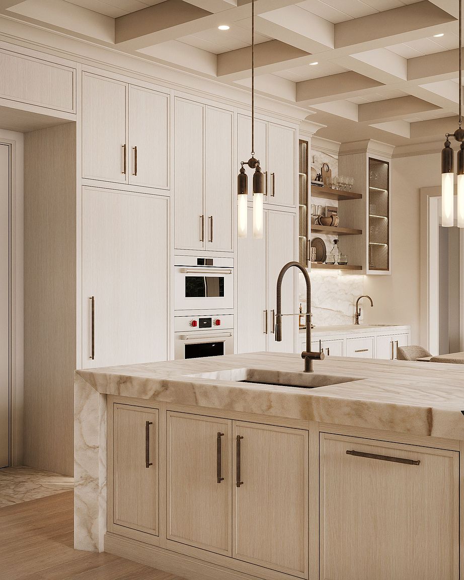 This sophisticated kitchen features light wood cabinetry and a substantial island topped with a thick, veined stone slab. The space is accented by dark metal hardware, a modern faucet, and elegant pendant lighting, while open shelving adds a decorative touch against the stone backsplash. The perspective captures the refined craftsmanship and clean lines of the cabinetry, highlighting a high-end, contemporary aesthetic.