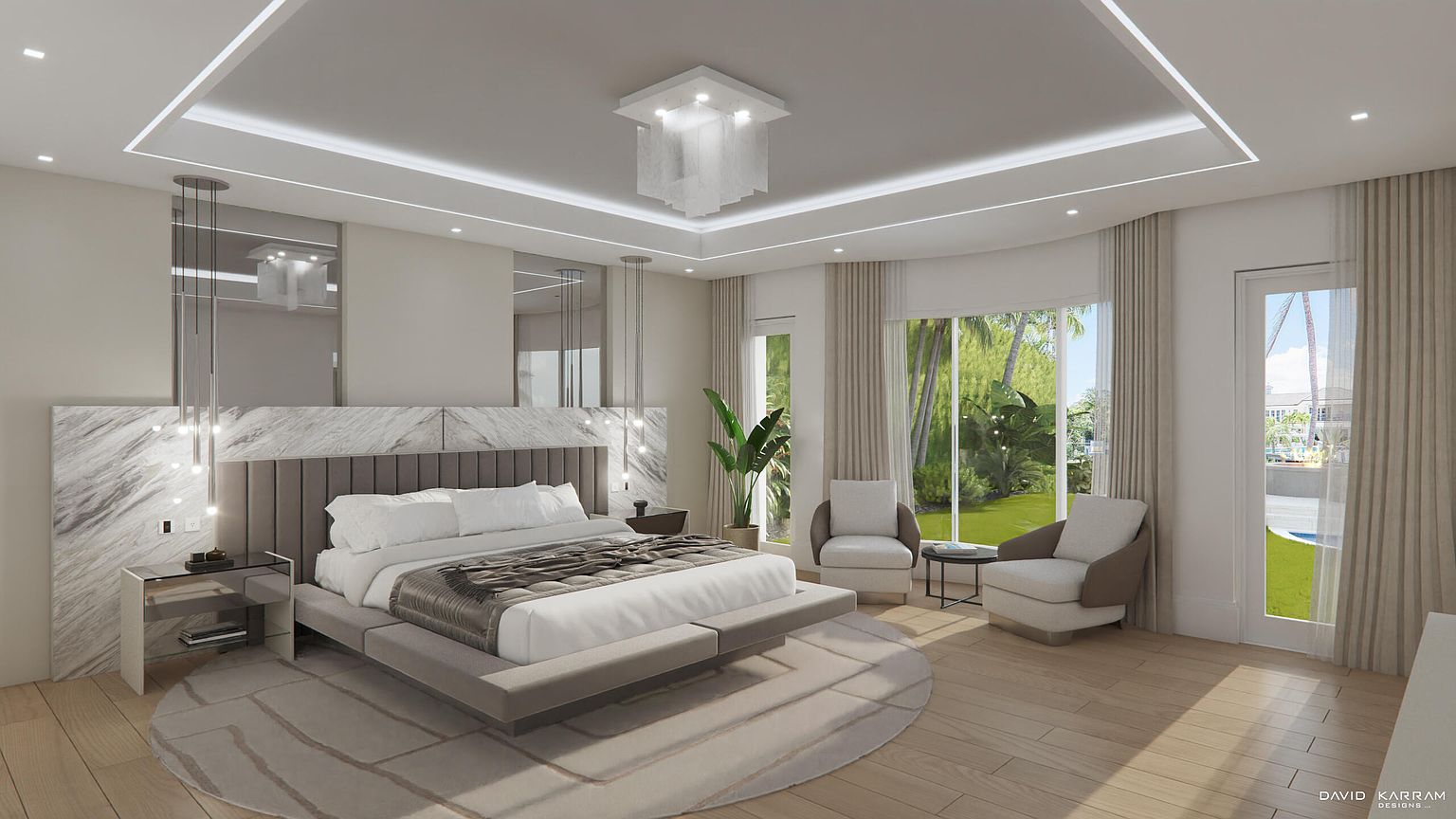 This is a luxurious primary bedroom featuring a king-size bed with a padded headboard and a marble accent wall. The room has a modern design with a neutral color palette, complemented by a stylish chandelier and recessed lighting. Large windows with sheer curtains offer views of the outdoor landscape, creating a serene and inviting atmosphere.