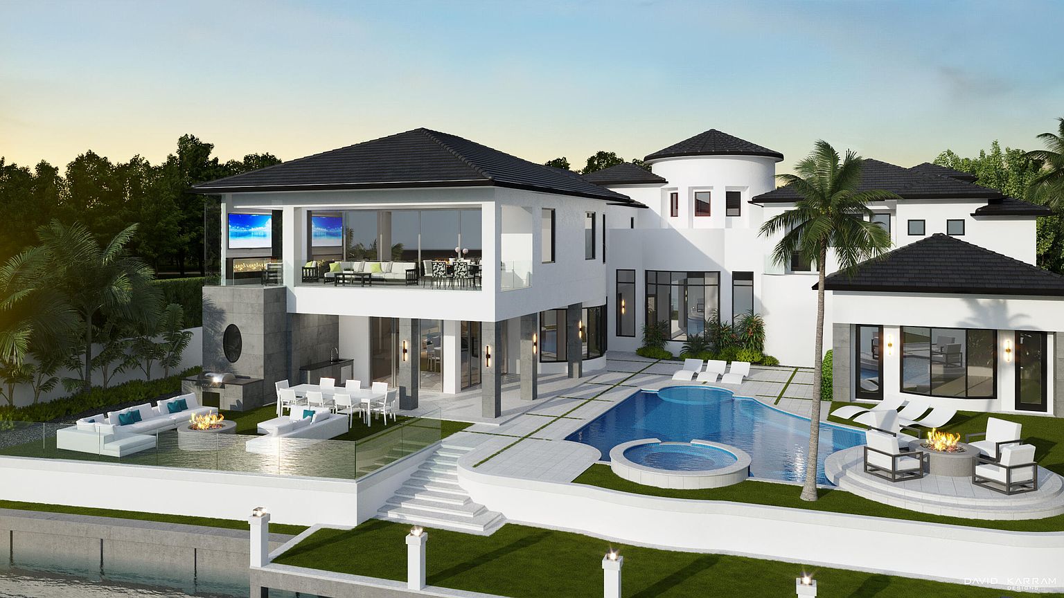 This is a stunning rear view of a modern luxury home, showcasing an expansive outdoor living space. The property features a large swimming pool with an integrated spa, multiple lounge areas with fire pits, and an outdoor dining area with a grill. The architecture is characterized by clean lines, white stucco, and dark roofing, creating a sophisticated and inviting atmosphere.