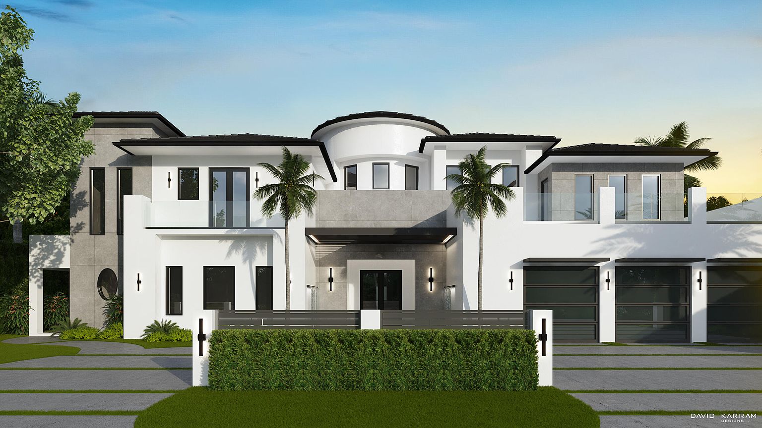 This is a front view of a modern, luxurious two-story house. The house features a combination of white and gray exterior walls, a rounded central section, and a flat roof with dark trim. The property includes a well-manicured lawn, a low hedge, palm trees, and a paved driveway leading to a multi-car garage, creating an inviting and upscale curb appeal.