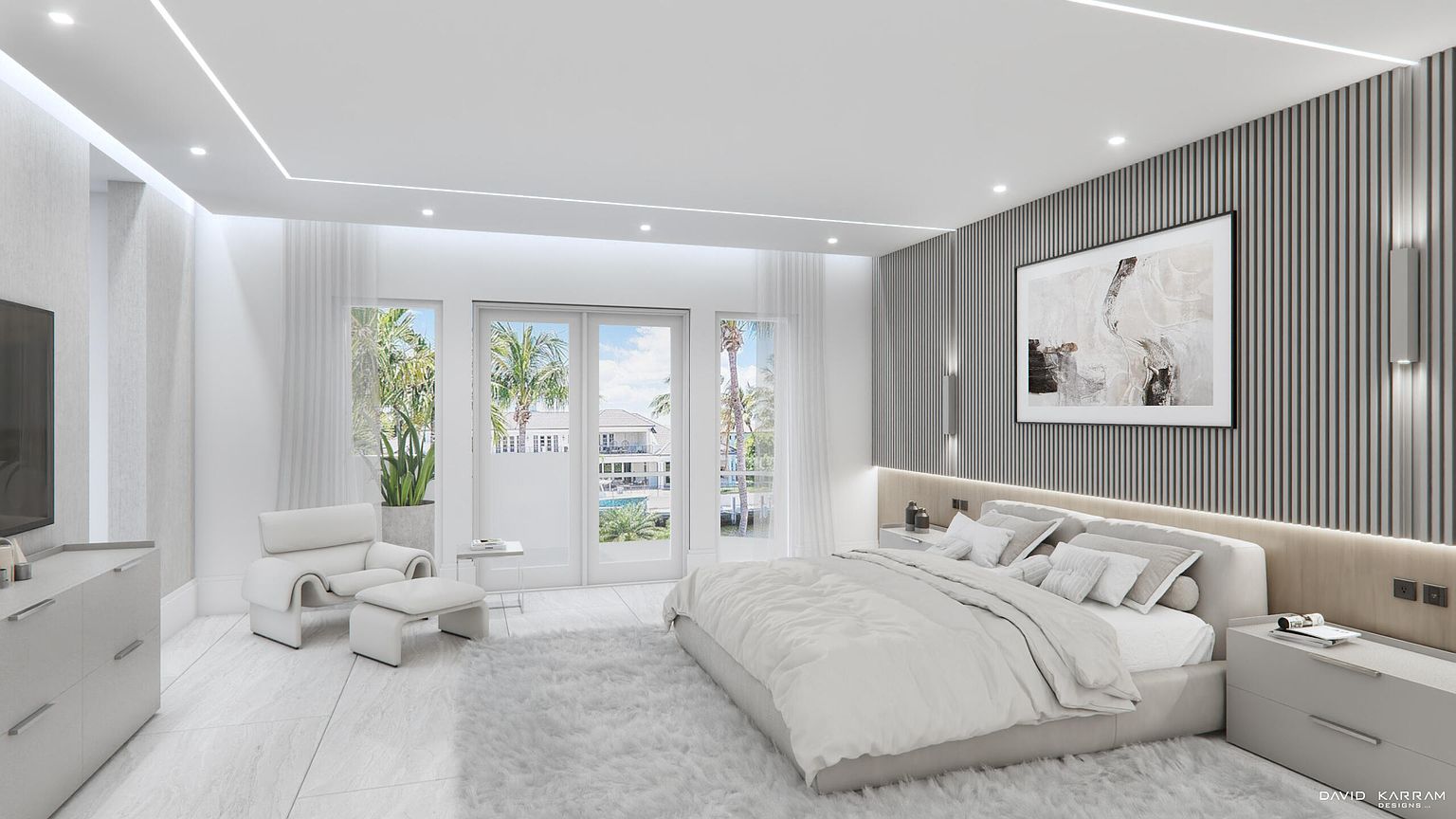 This is a bright and airy primary bedroom featuring a large bed with white linens, a gray accent wall with modern artwork, and floor-to-ceiling windows that offer a view of the outdoors. The room is decorated in a minimalist style with a neutral color palette, creating a serene and inviting atmosphere. The perspective is from the foot of the bed, looking towards the windows and accent wall.