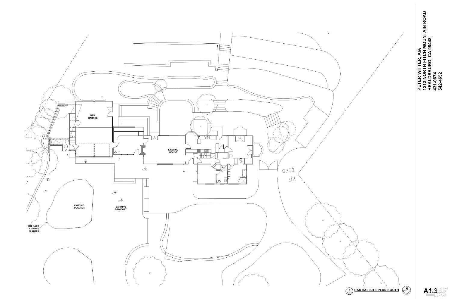 This image is a detailed architectural site plan showing the layout of an existing house and a proposed new garage. The drawing illustrates the footprint of the structures, the existing driveway, and surrounding landscape features like planters and pathways. It provides a technical top-down perspective of the property's spatial organization and site development.