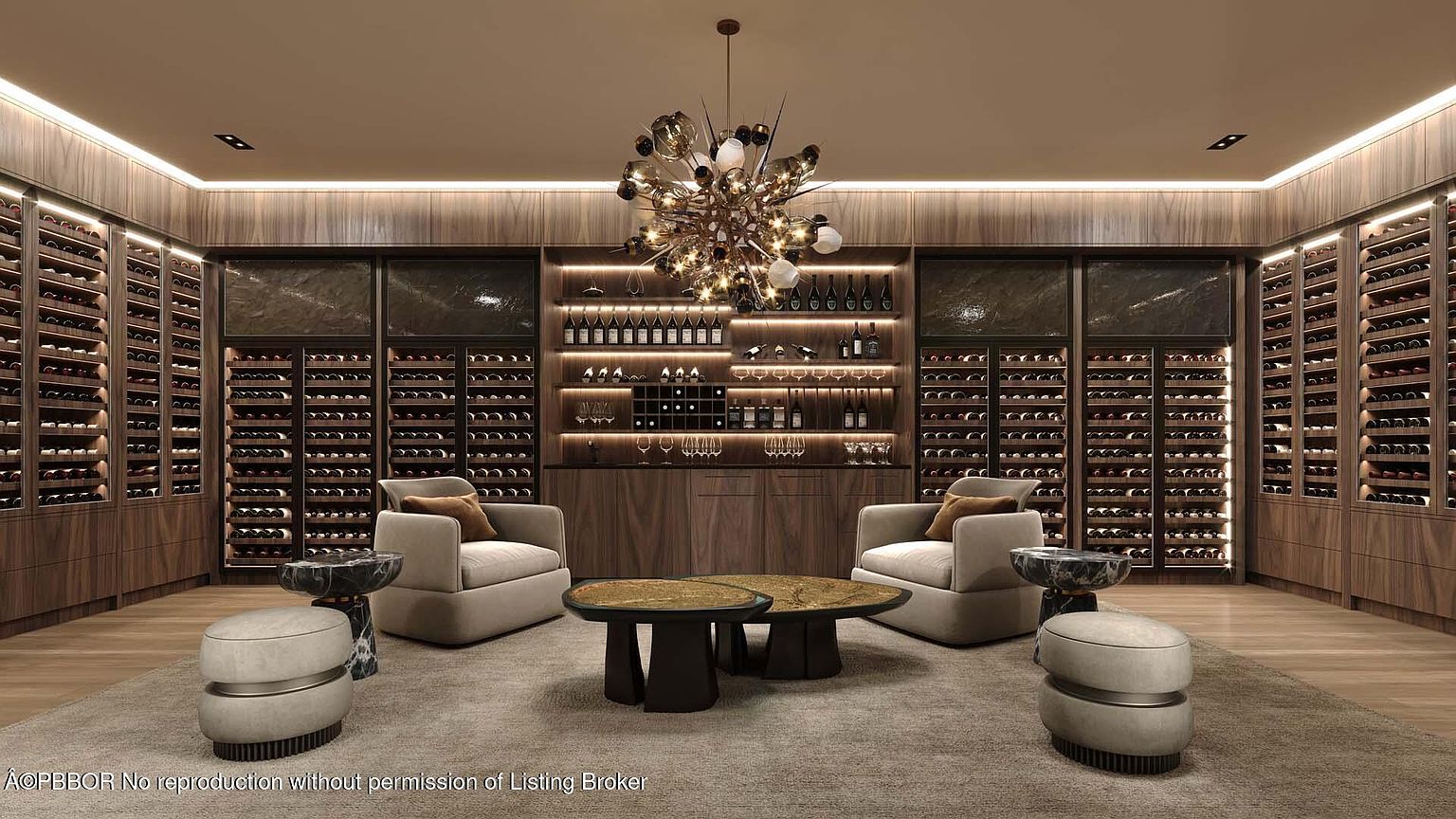 This is a luxurious wine cellar featuring extensive wooden wine racks filled with bottles, complemented by a central display area with glassware and additional bottles. Two armchairs and ottomans are arranged around a pair of coffee tables, creating a comfortable tasting area under a modern chandelier. The room is well-lit with accent lighting highlighting the wine collection and creating a warm ambiance.