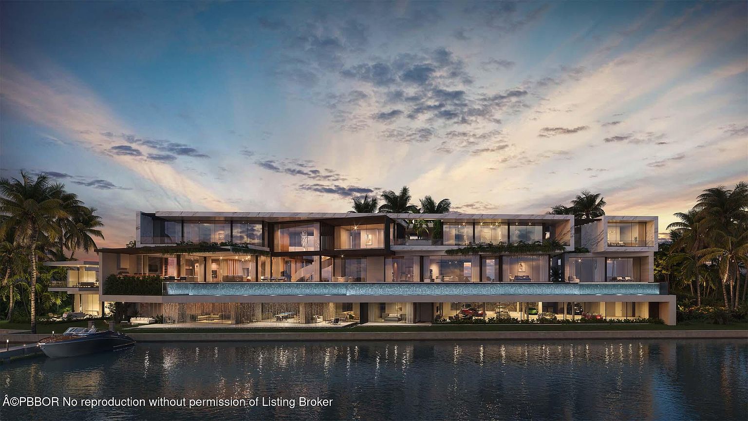 This is a stunning rear view of a modern luxury waterfront home. The multi-level structure features expansive glass windows and balconies, offering panoramic views of the water. A large pool with a waterfall feature adds to the opulence, while palm trees and lush landscaping provide a tropical backdrop. A boat is docked nearby, emphasizing the waterfront lifestyle.
