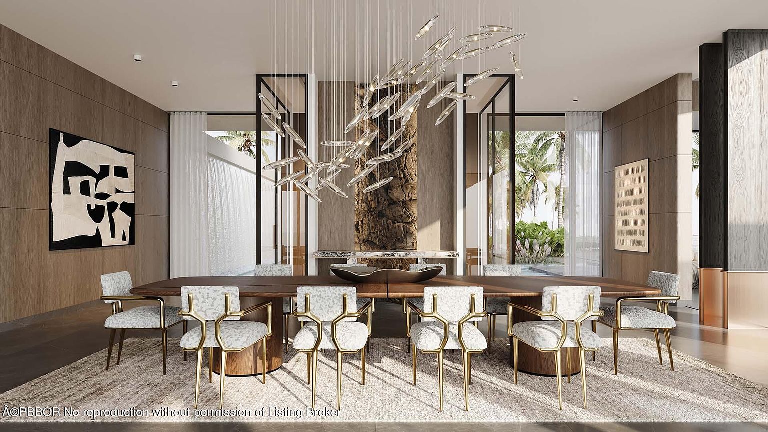This is an elegant dining room featuring a long wooden table surrounded by stylish chairs with gold frames and patterned upholstery. A modern chandelier hangs above the table, and large windows offer views of the exterior. The room is decorated with artwork and has a sophisticated, contemporary design.