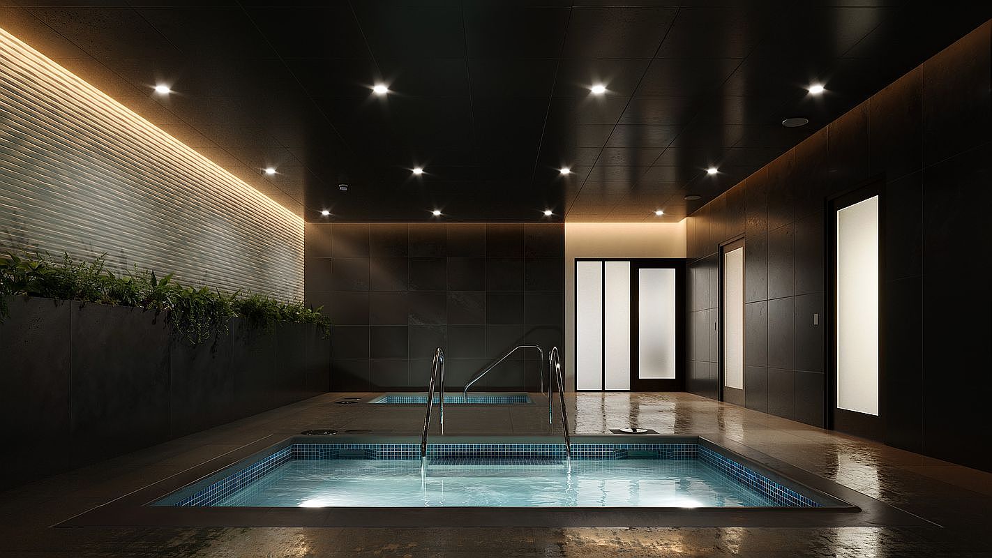 This sophisticated indoor spa area features two recessed hot tubs with blue mosaic tile interiors, set against a backdrop of dark, textured wall tiles and a sleek, modern ceiling with recessed lighting. A long planter box filled with lush greenery runs along the side wall, illuminated by warm, indirect cove lighting that creates a serene and luxurious atmosphere. The perspective is centered and low, emphasizing the depth of the pools and the high-end, tranquil design of the facility.