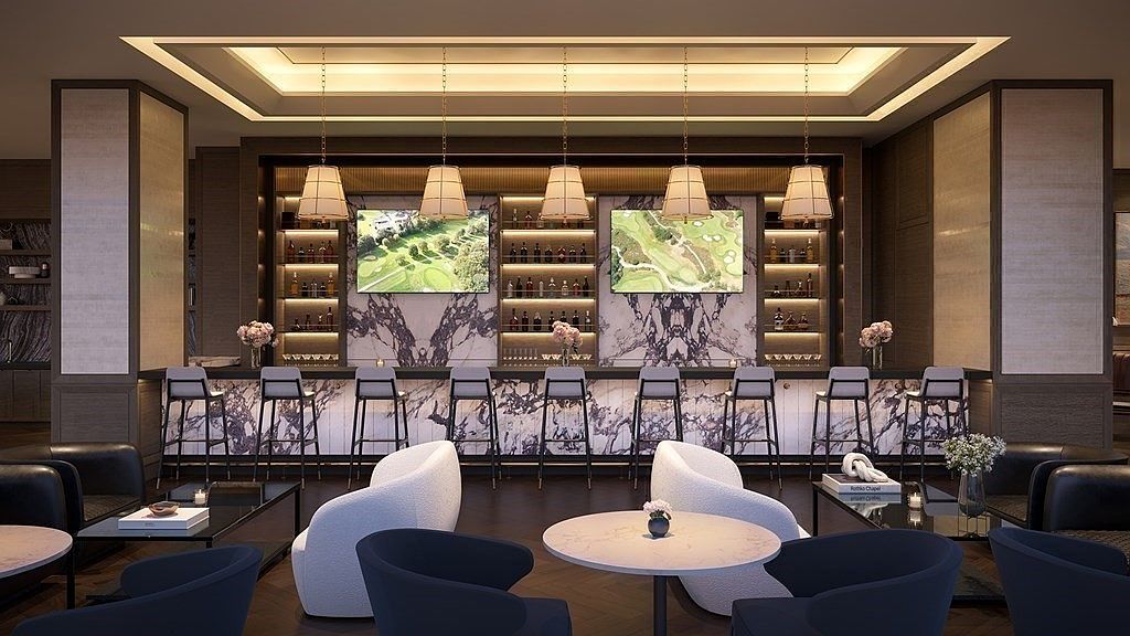 This sophisticated lounge and bar area features a striking purple-veined marble bar counter, complemented by sleek, modern bar stools and elegant pendant lighting. The space is designed for social gatherings, with plush white armchairs and dark blue seating arranged in intimate conversation areas. The overall aesthetic is upscale and contemporary, creating a luxurious atmosphere perfect for a high-end residential clubhouse.
