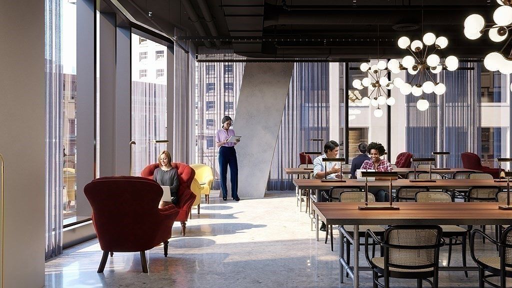 This sophisticated, modern co-working lounge features high ceilings, floor-to-ceiling windows, and a mix of plush velvet armchairs and long wooden communal tables. The space is illuminated by striking, multi-bulb spherical chandeliers, creating a professional yet inviting atmosphere for residents or tenants. The open-concept layout, combined with the polished concrete floors and contemporary furniture, offers a premium, high-end aesthetic suitable for a luxury apartment complex or corporate office building.