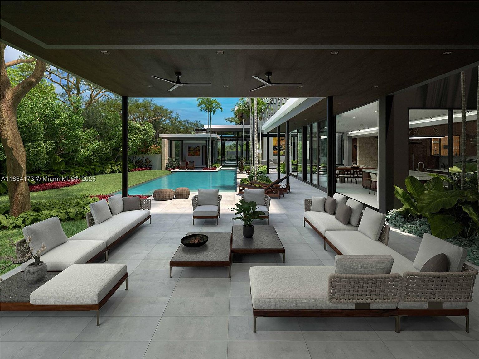 This image showcases a luxurious outdoor patio area with modern furnishings, including multiple sofas, chairs, and coffee tables arranged on a large tiled surface. The patio overlooks a stunning pool and a well-manicured lawn, with a contemporary house design visible in the background. The space is designed for relaxation and entertainment, blending indoor and outdoor living seamlessly.