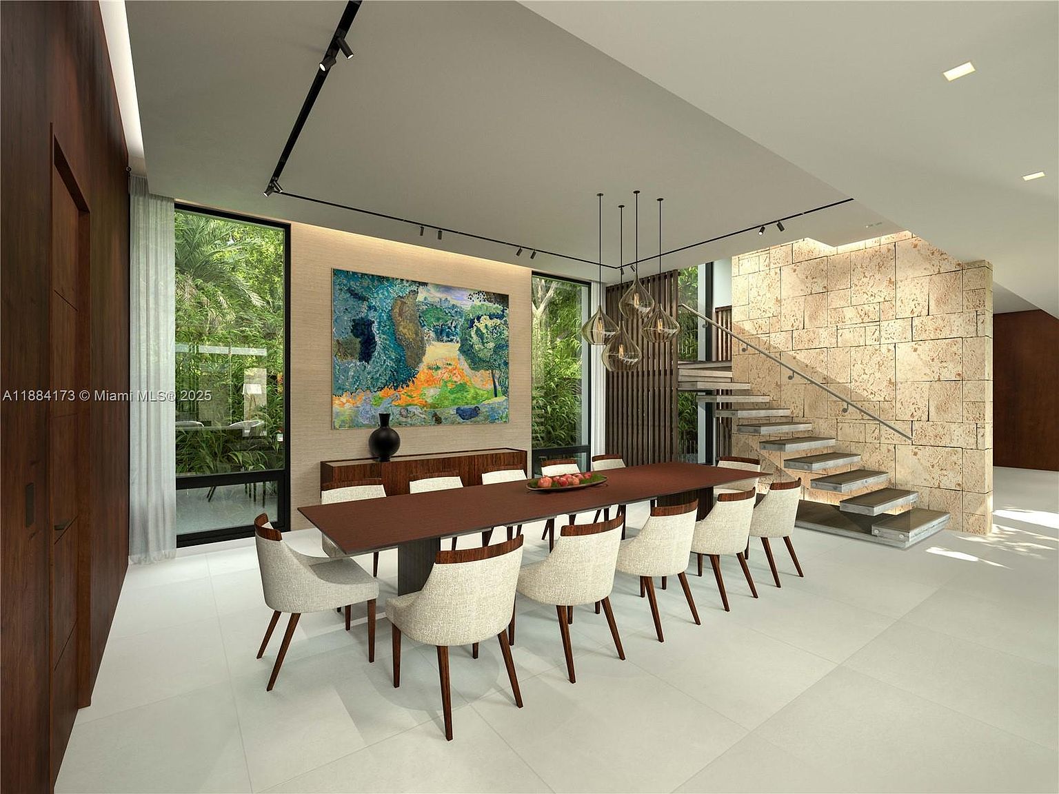 This is a dining room featuring a long, dark wood table with seating for ten. The chairs are upholstered in a light fabric with dark wood legs. A large, colorful painting hangs on the wall above a credenza, and modern pendant lights hang above the table. The room has a contemporary style with large windows offering views of lush greenery and a unique staircase design.
