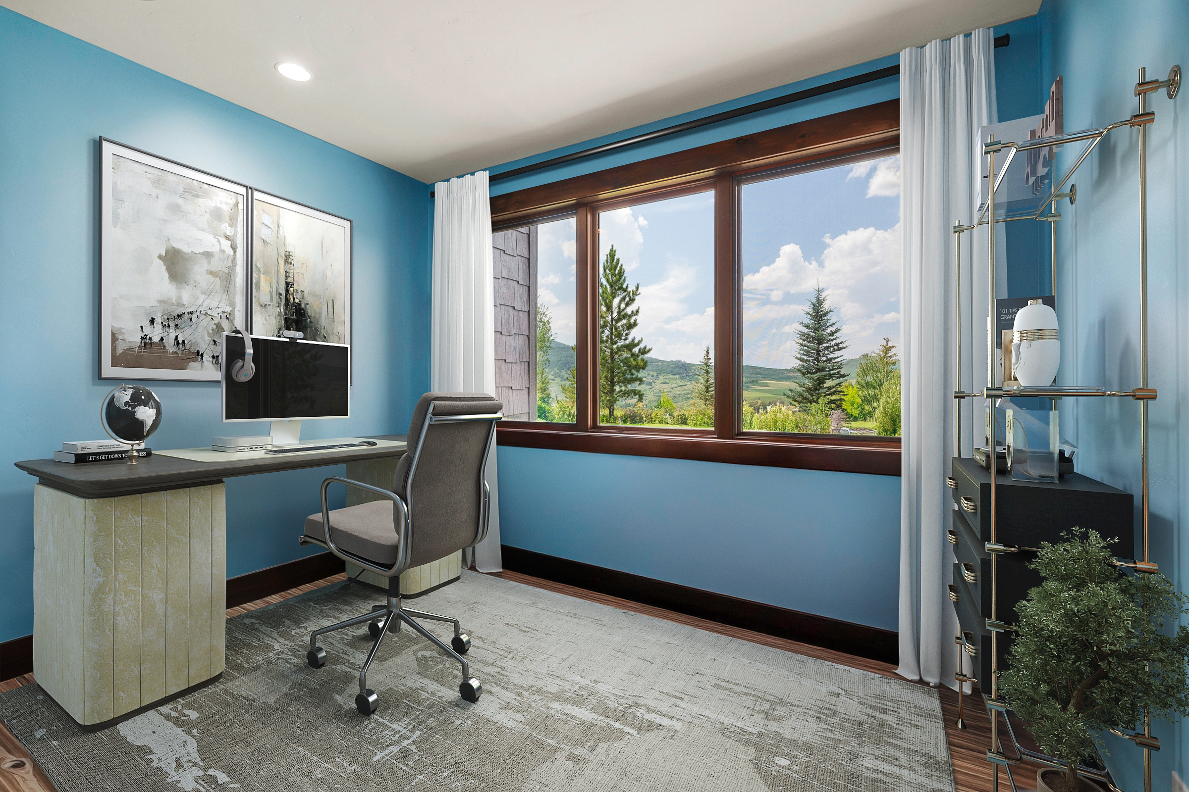 This is a cozy home office featuring a desk with a computer and a globe accessory. The room is illuminated by natural light from a large window offering a scenic view, complemented by blue walls and a neutral-toned rug. The overall style is modern and inviting, creating a comfortable workspace.