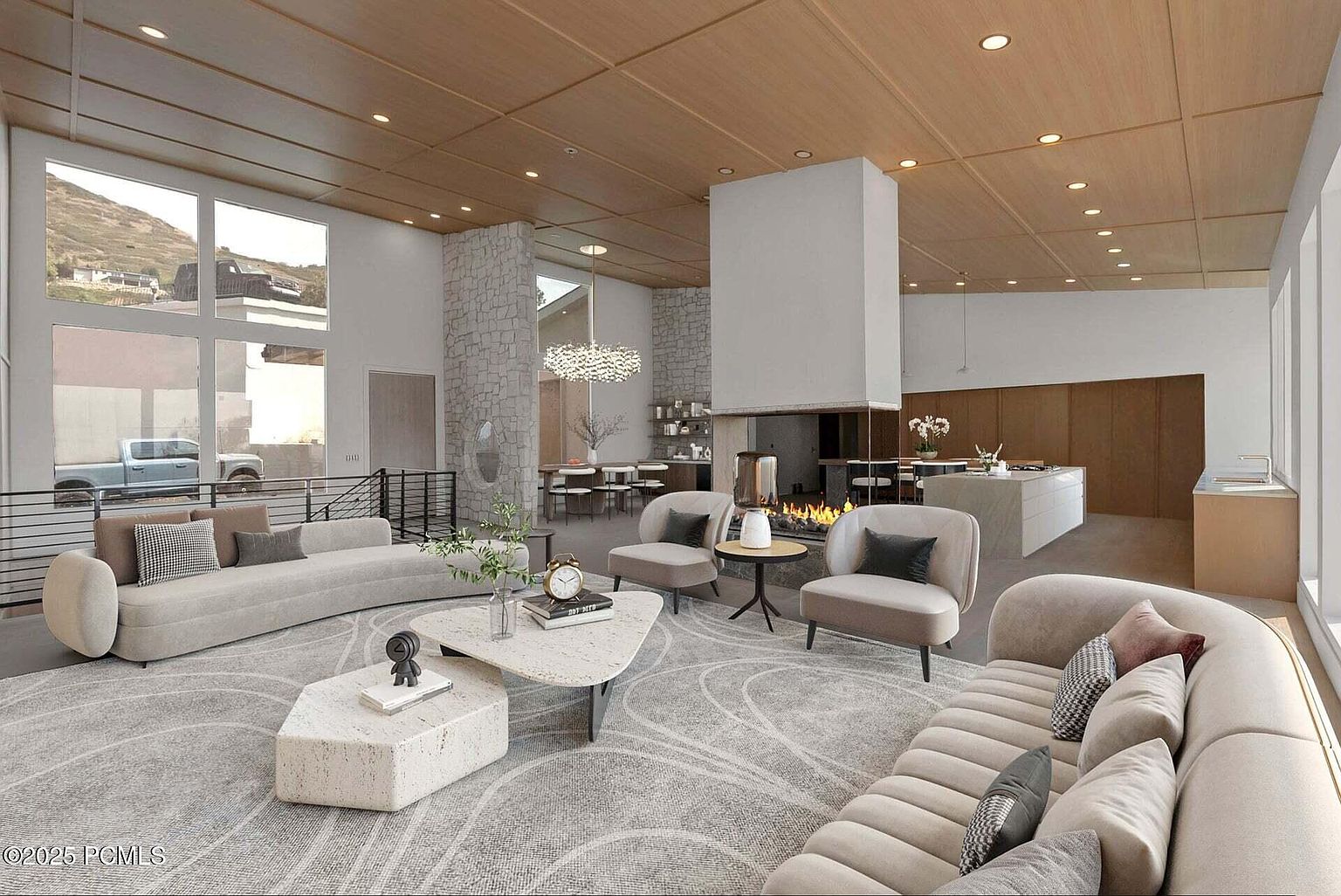 This is a spacious and modern living room featuring curved sofas, a unique coffee table, and a fireplace. Large windows provide ample natural light, and the open floor plan seamlessly connects the living area to the dining and kitchen spaces. The overall design is contemporary and luxurious, creating a comfortable and inviting atmosphere.