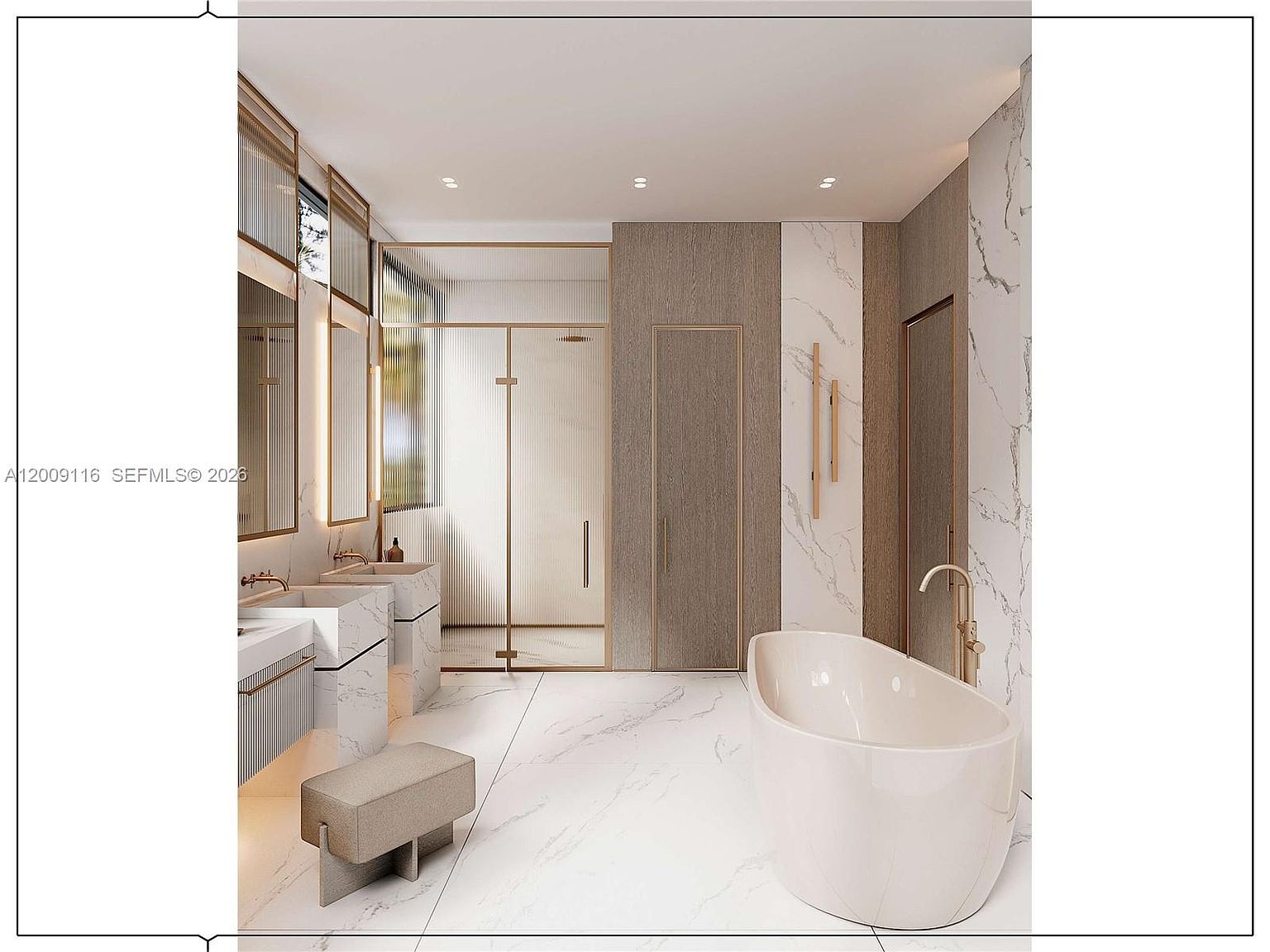 This luxurious primary bathroom features a freestanding soaking tub with a gold-toned faucet, set against a backdrop of white stone walls with grey veining. A double vanity with integrated sinks and a small stool sits to the left, while a glass-enclosed shower area with ribbed glass panels adds a modern, textured element. The space is accented with warm wood-toned panels and minimalist gold hardware, creating a sophisticated and serene atmosphere.