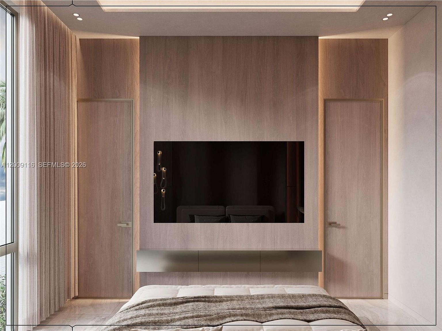 This modern primary bedroom features a central wall clad in light wood paneling with integrated accent lighting, framing a wall-mounted television. A sleek, floating metal console sits beneath the screen, while symmetrical doors on either side provide a clean, minimalist aesthetic. To the left, large windows draped in floor-to-ceiling curtains allow soft natural light to enter the space, creating a serene and sophisticated atmosphere.