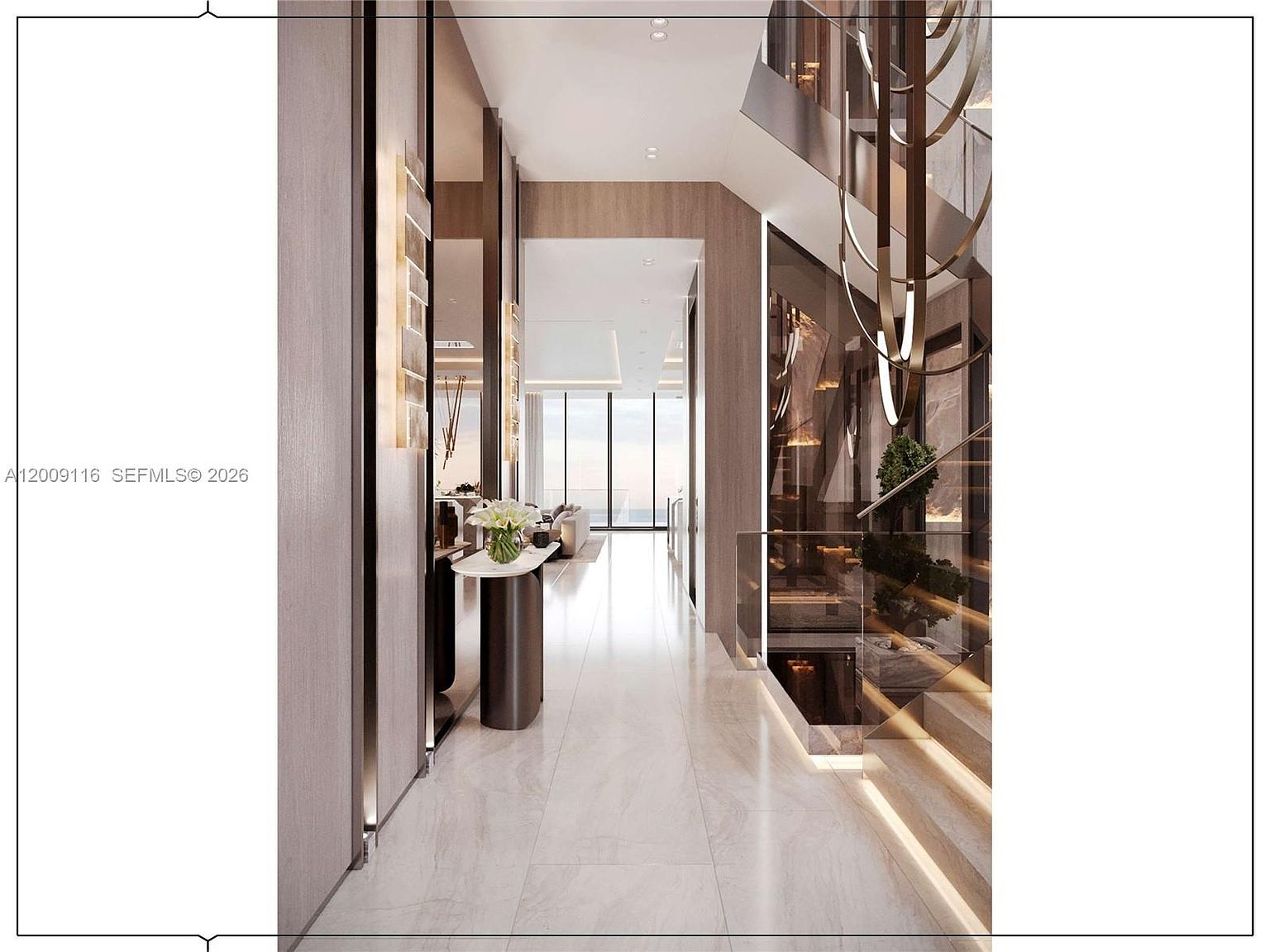 This sophisticated interior view captures a grand hallway leading toward a bright living space, featuring polished light-toned flooring and warm wood-paneled walls. To the right, a striking staircase with glass railings and integrated step lighting creates a dramatic focal point, complemented by a sculptural, multi-tiered chandelier. The perspective draws the eye through the corridor, highlighting the clean lines, modern aesthetic, and seamless transition between levels.