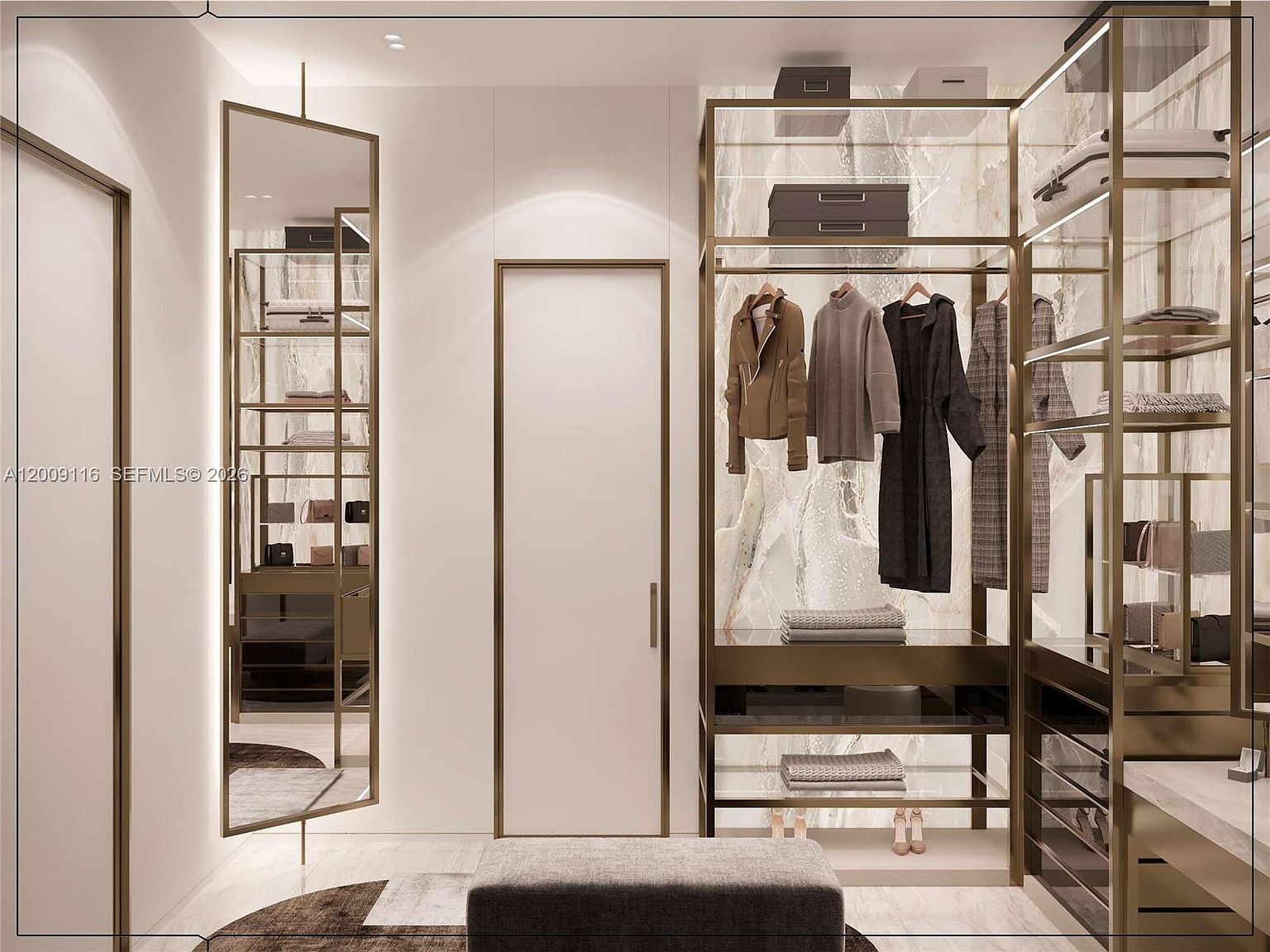 This sophisticated walk-in closet features a contemporary design with metallic-framed shelving and a striking stone-patterned back wall. A tall, free-standing mirror stands to the left, while a central upholstered bench provides a functional seating area. The space is illuminated by recessed lighting, creating a luxurious and organized atmosphere.
