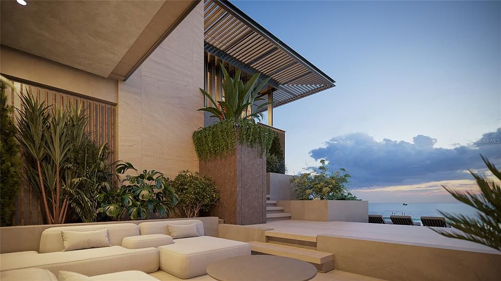 This image showcases a luxurious outdoor patio/deck/balcony area with modern architectural design. The space features comfortable lounge seating, lush greenery, and a stunning ocean view at dusk. The design incorporates clean lines, natural materials, and a seamless integration of indoor and outdoor living.